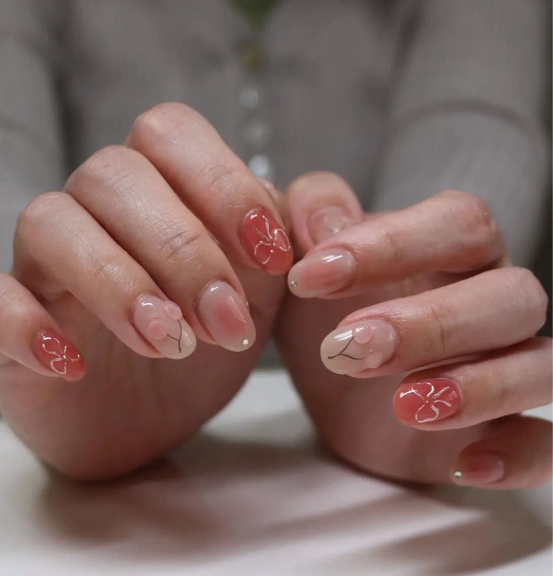 ネイル チークネイル 韓国ネイル ニュアンスネイル ピンク リボン ハンドネイル Baku Nailsのネイルデザイン