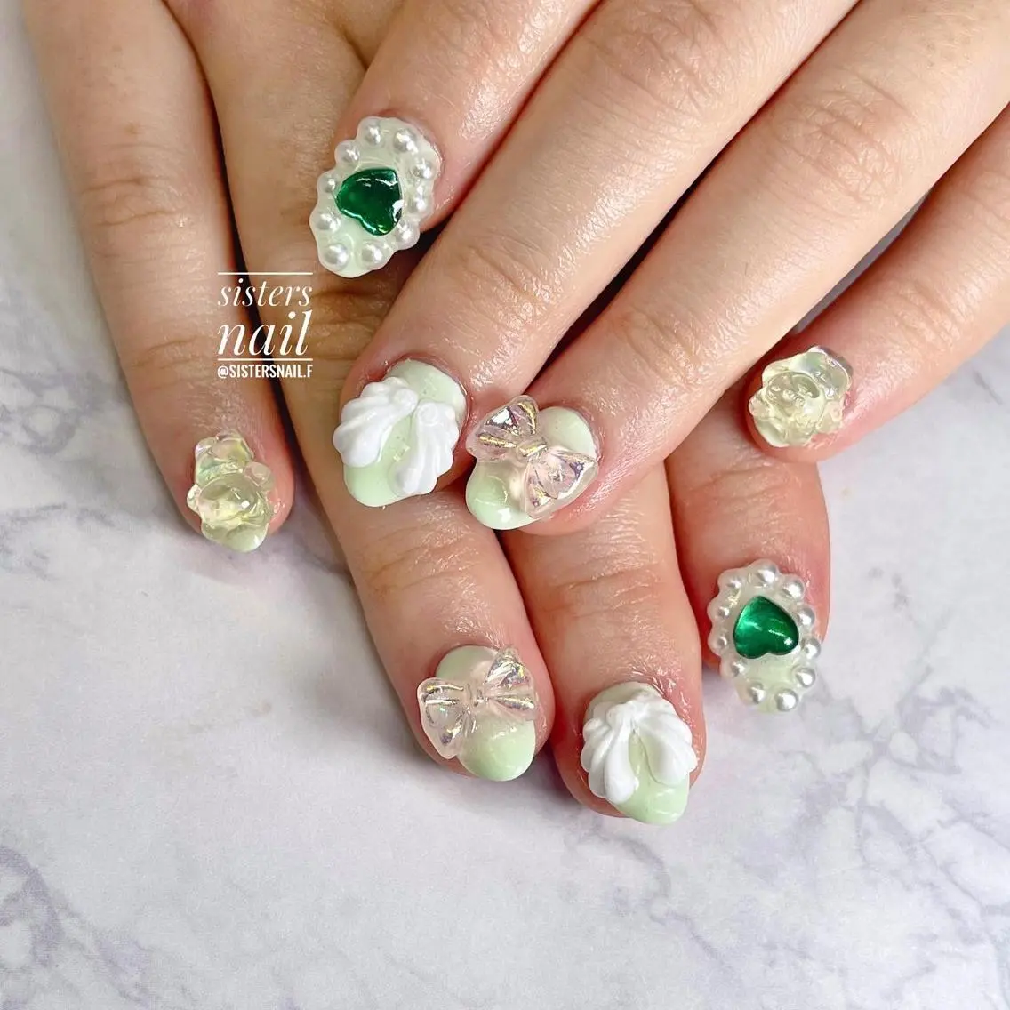 ネイル アートネイル グリーン ハート パステルネイル リボン sisters nail.fのネイルデザイン