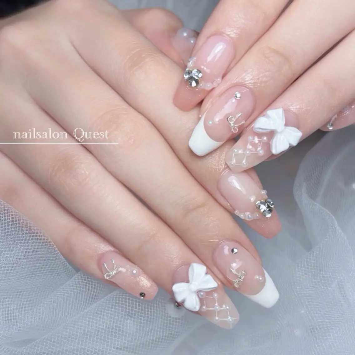 ネイル ガーリー キラキラネイル ピンク リボン 春ネイル ハンドネイル nailsalon Questのネイルデザイン
