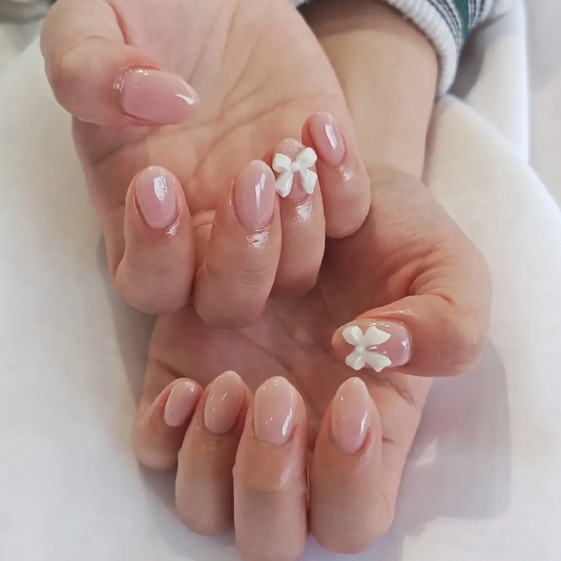 ネイル ワンカラーネイル リボン 春ネイル ハンドネイル felicita fumi🩷のネイルデザイン