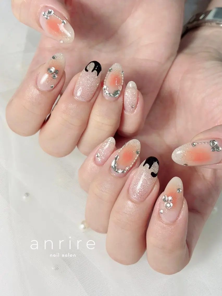 ネイル チークネイル ハロウィン キラキラネイル オレンジ nailsalon anrireのネイルデザイン