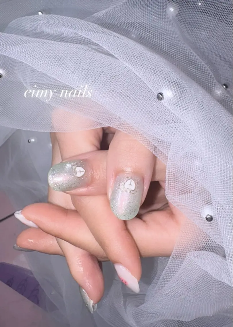 ネイル オーロラネイル フラッシュネイル グラデーション グリーン ハート ハンドネイル eimy nails♡のネイルデザイン