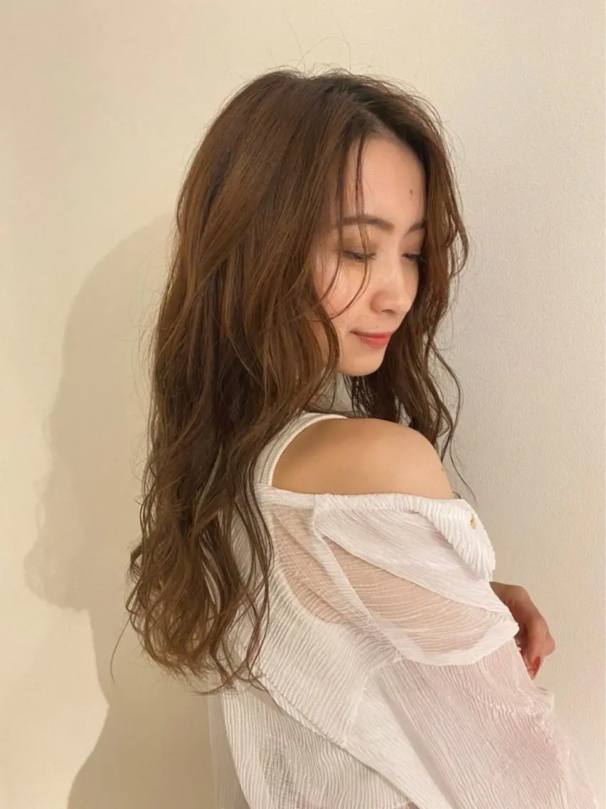 お出かけ前のコテ巻き🧡の写真