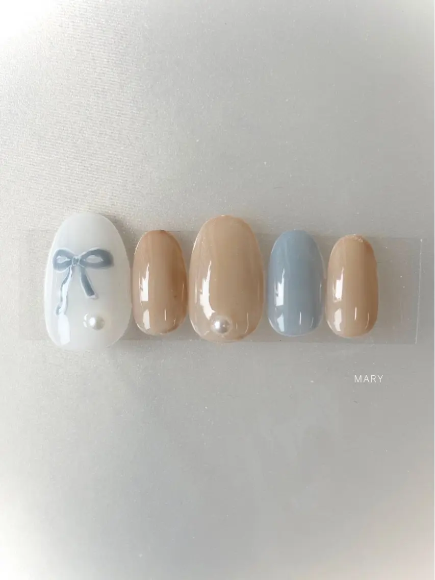 ネイル 水色 ニュアンスネイル リボン ハンドネイル Mary nail .narumiのネイルデザイン