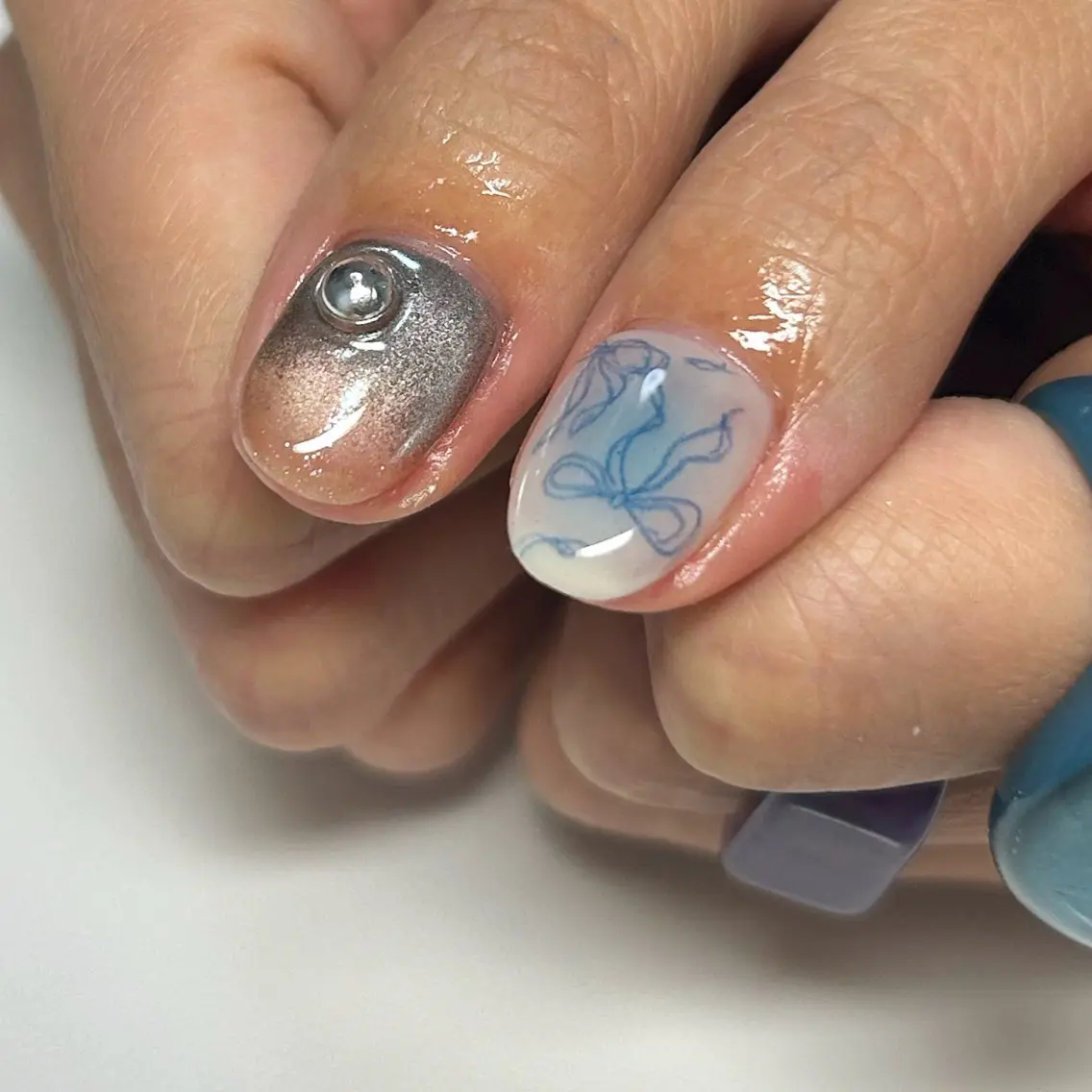 ネイル ブルー リボン ハンドネイル ユキ @_yk_nail_のネイルデザイン