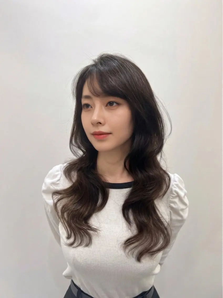 レイヤーカット+髪質改善コテ巻き風パーマの写真