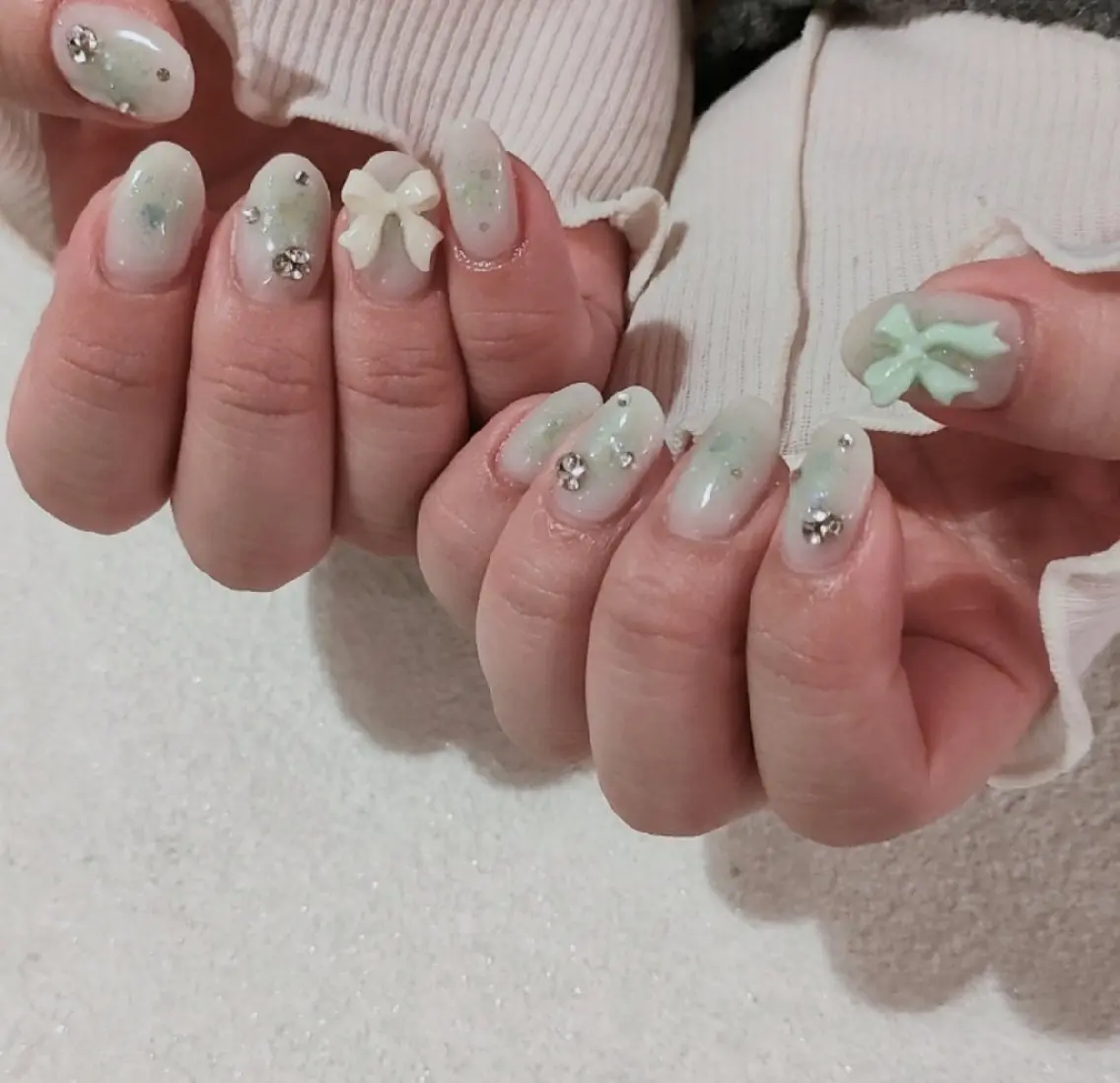 ネイル チークネイル パステルネイル リボン 春ネイル ストーンネイル ハンドネイル marusalo nailのネイルデザイン