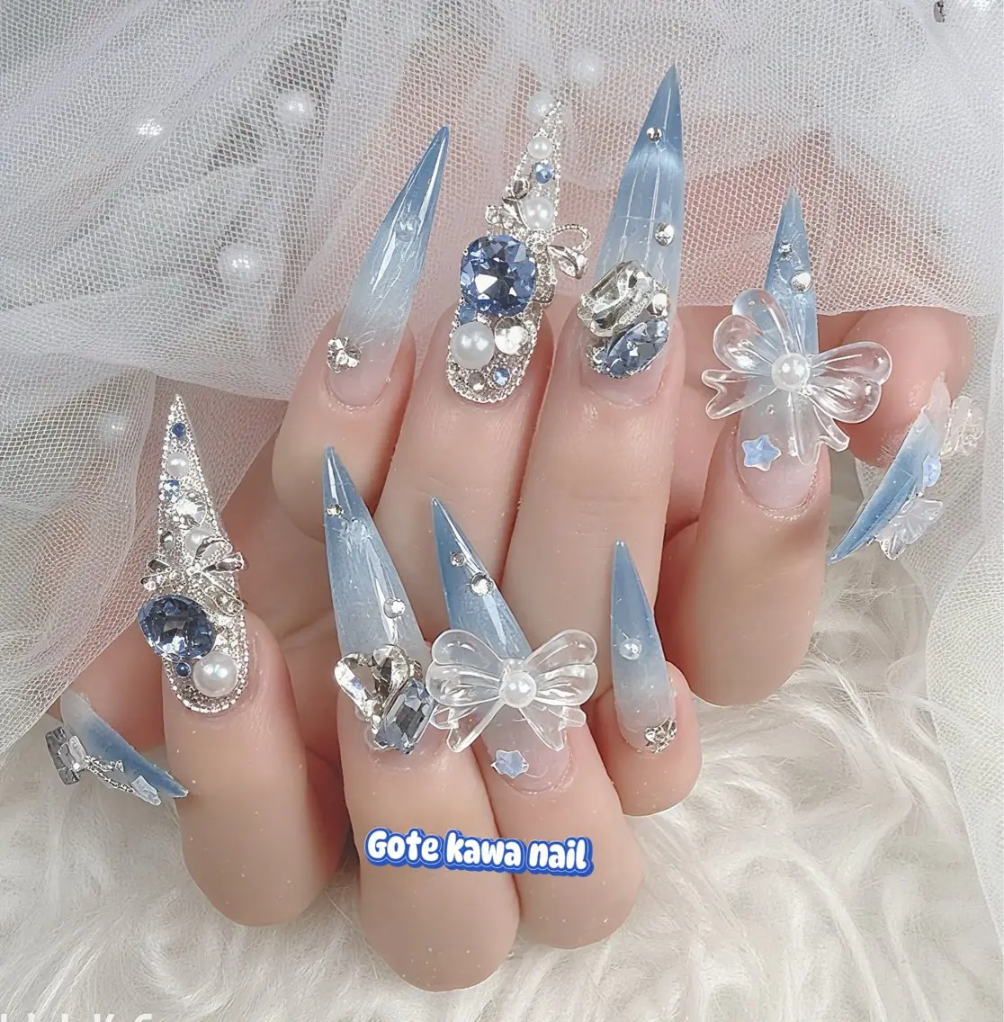 ネイル ブルー グラデーション 水色 マグネットネイル リボン ハンドネイル ハンドケア Gote Kawa nail salonのネイルデザイン