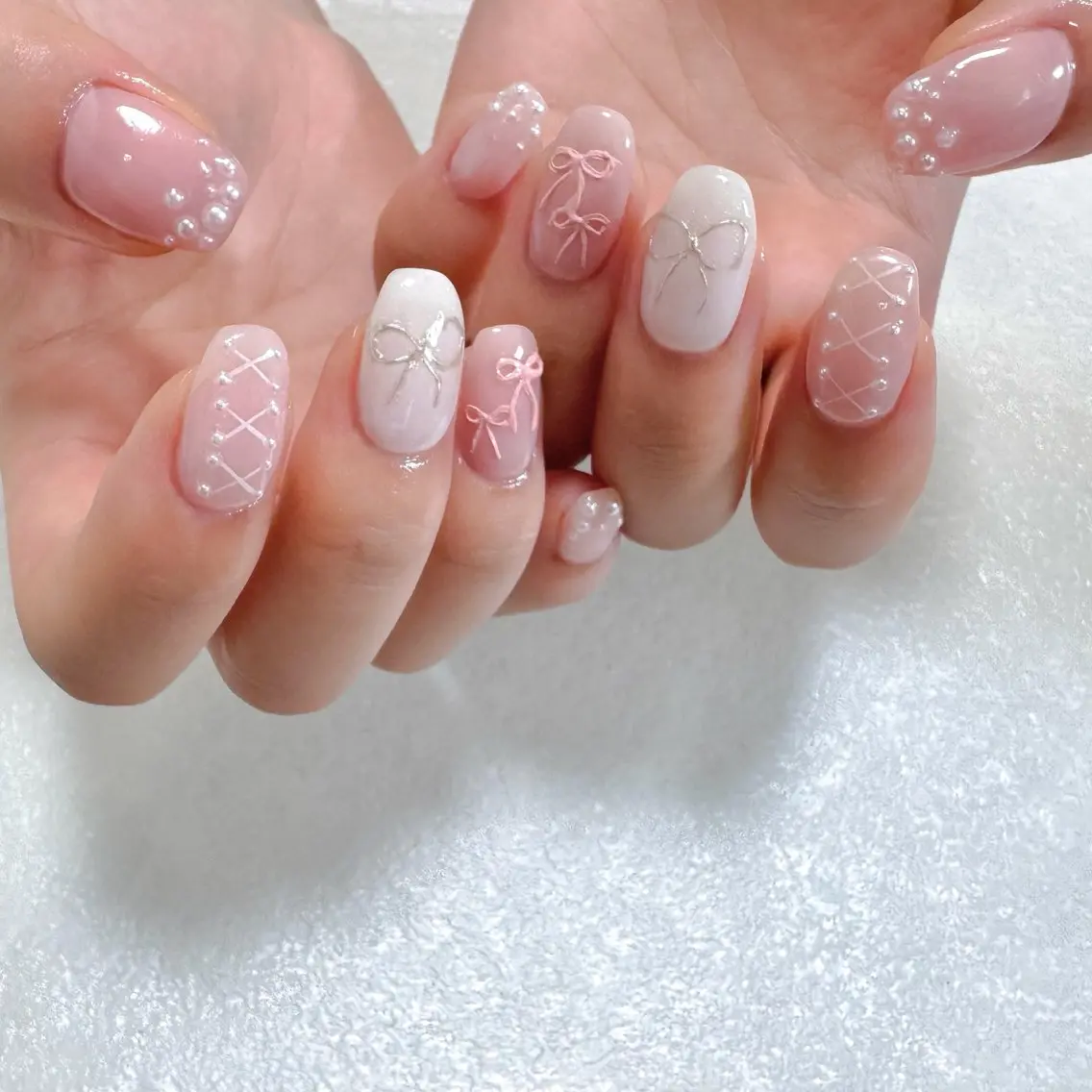 ネイル 韓国ネイル ピンク ピンクベージュ ぷっくりネイル リボン ハンドネイル pointillé .ayaのネイルデザイン