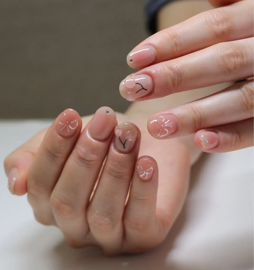 ネイル チークネイル ニュアンスネイル ピンク リボン ハンドネイル Baku Nailsのネイルデザイン