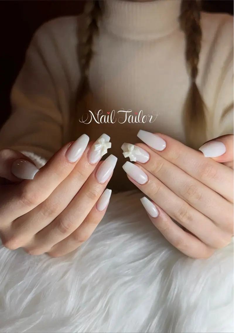 ネイル 長さ出し ガーリー ロングネイル ワンカラーネイル リボン ハンドネイル NailTailor ネイルテイラーのネイルデザイン