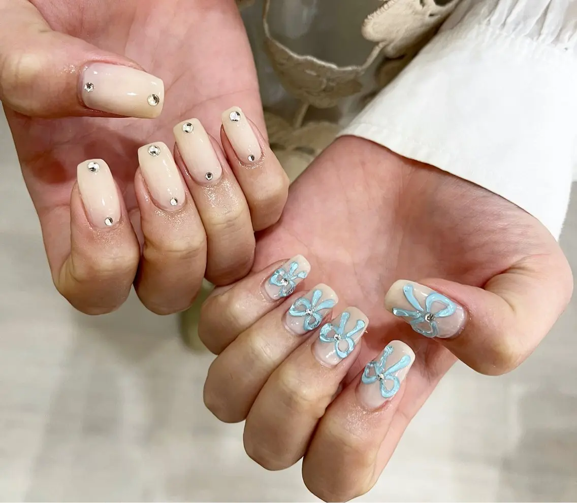 ネイル リボン ワンホンネイル #Amin nail salonのネイルデザイン