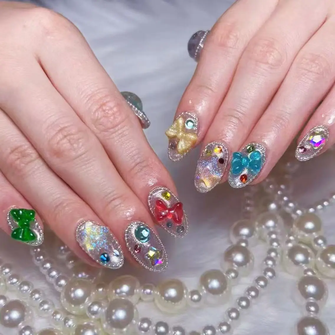 ネイル アートネイル オーロラネイル フラッシュネイル ガーリー キラキラネイル ハンドネイル Una NAILMANAMIのネイルデザイン