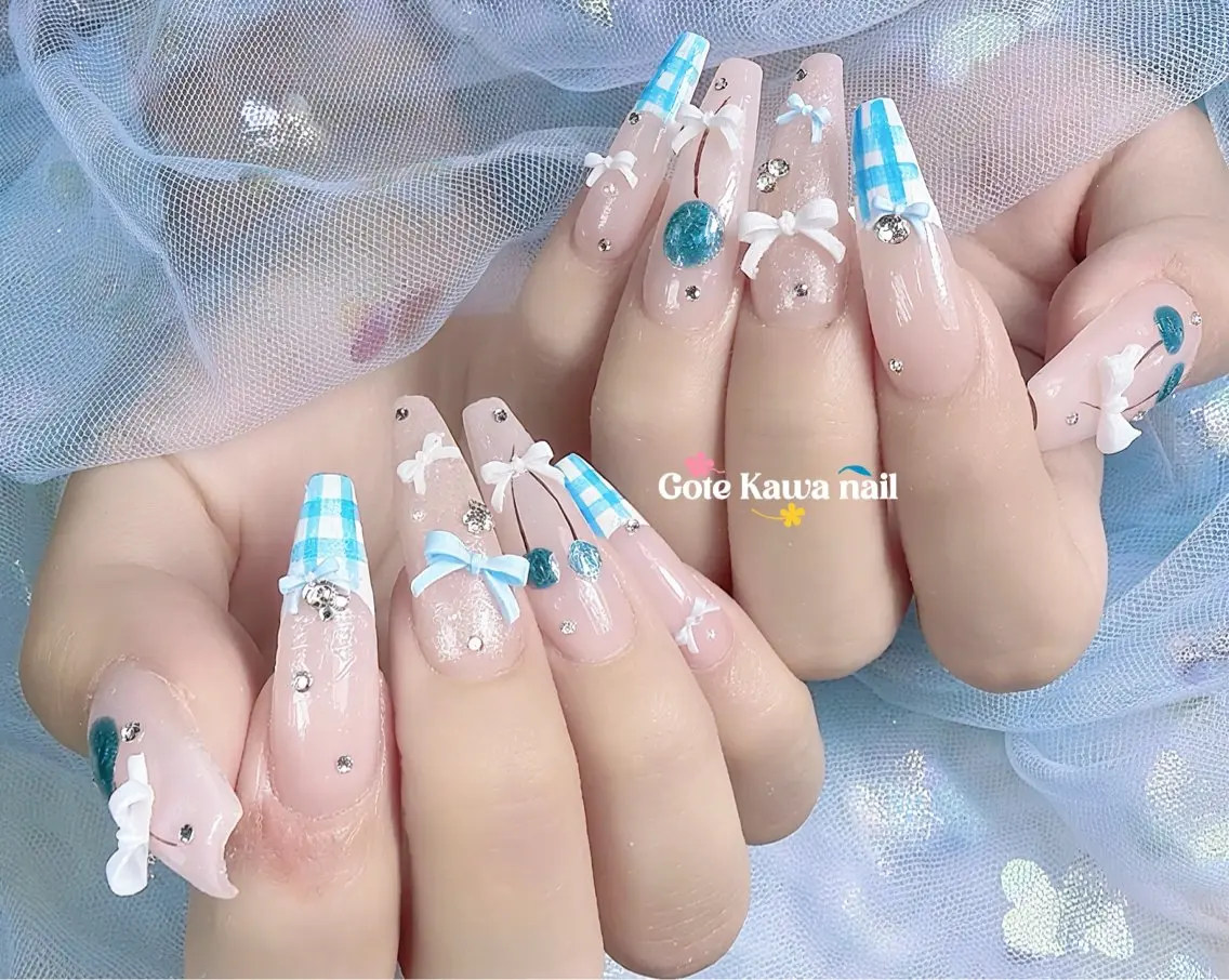 ネイル 水色 リボン 夏ネイル ハンドネイル ハンドケア Gote Kawa nail salonのネイルデザイン