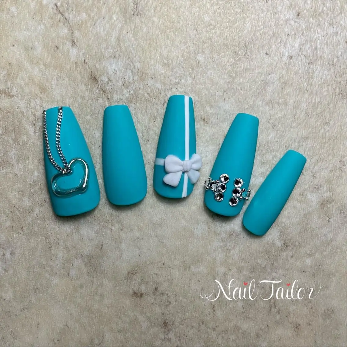ネイル 長さ出し ワンカラーネイル リボン 春ネイル NailTailor ネイルテイラーのネイルデザイン