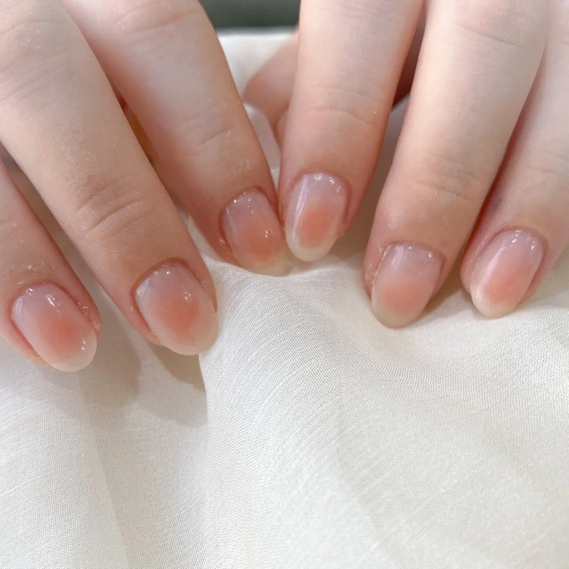 ネイル チークネイル オレンジ ピンク muguet🎀 chikaのネイルデザイン