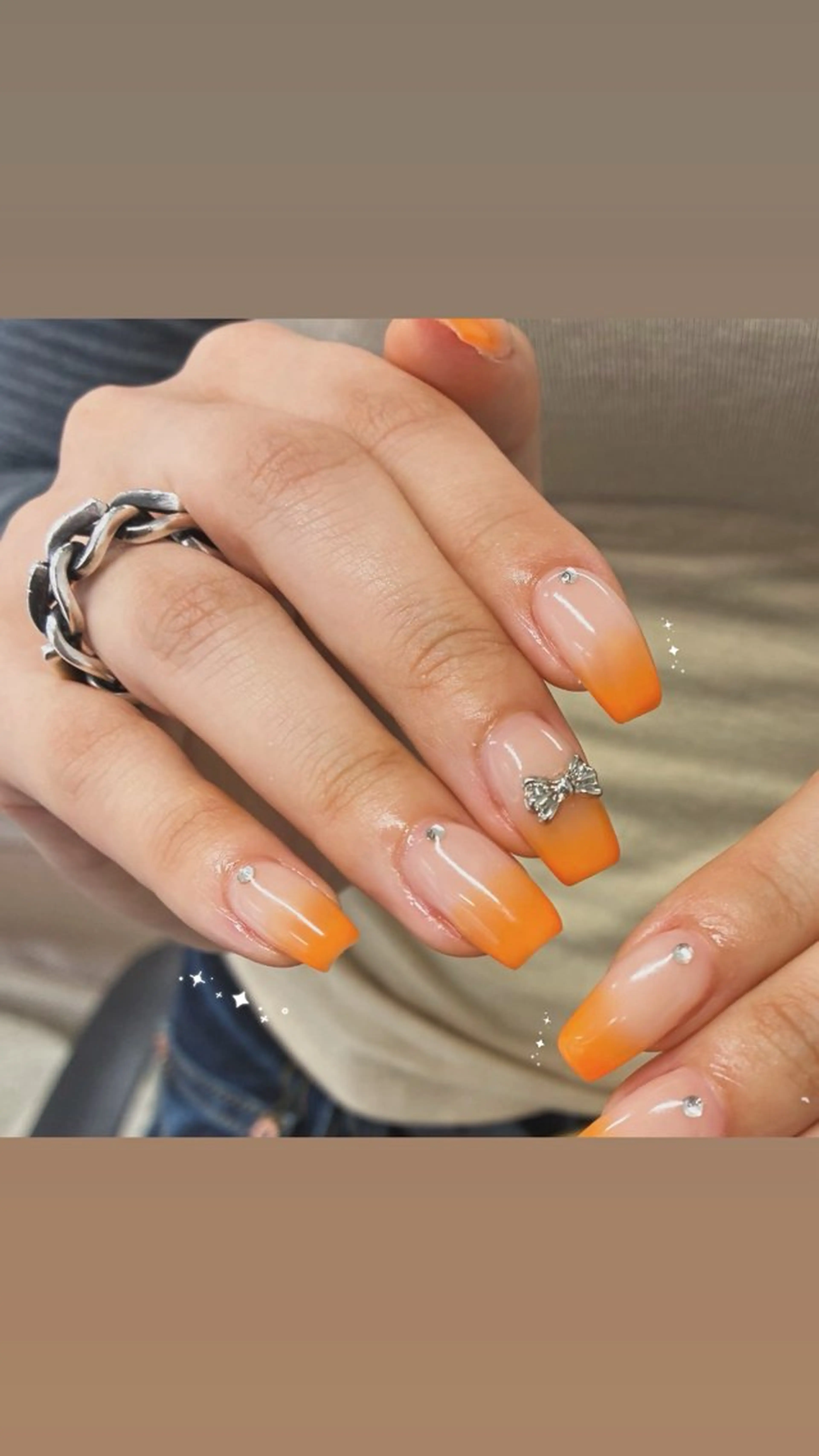 ネイル キラキラネイル オフィスネイル ワンカラーネイル オレンジ リボン ハンドネイル Risa 梅田/南森町ネイルのネイルデザイン