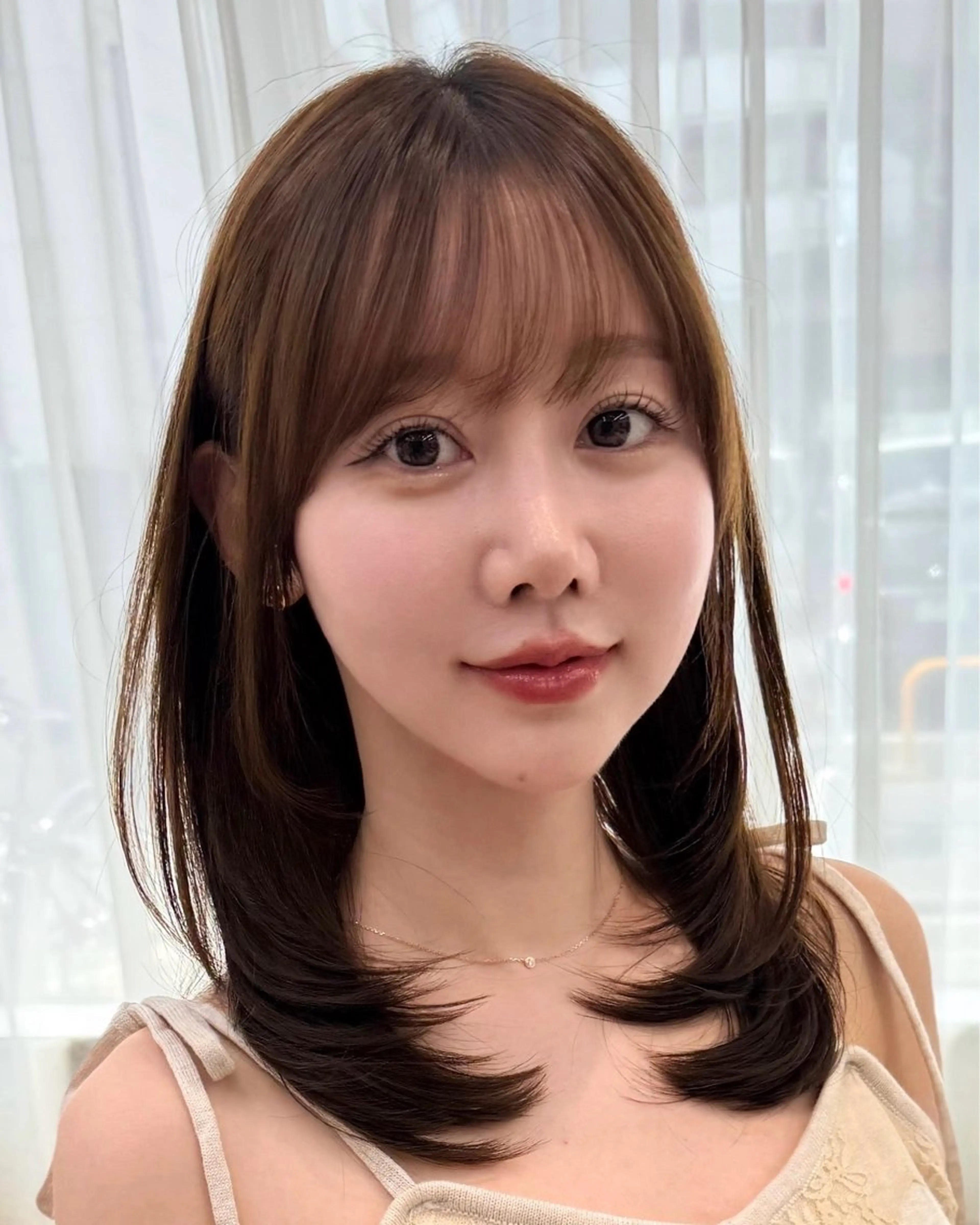 面長さん必見 中顔面短縮レイヤーカットの写真