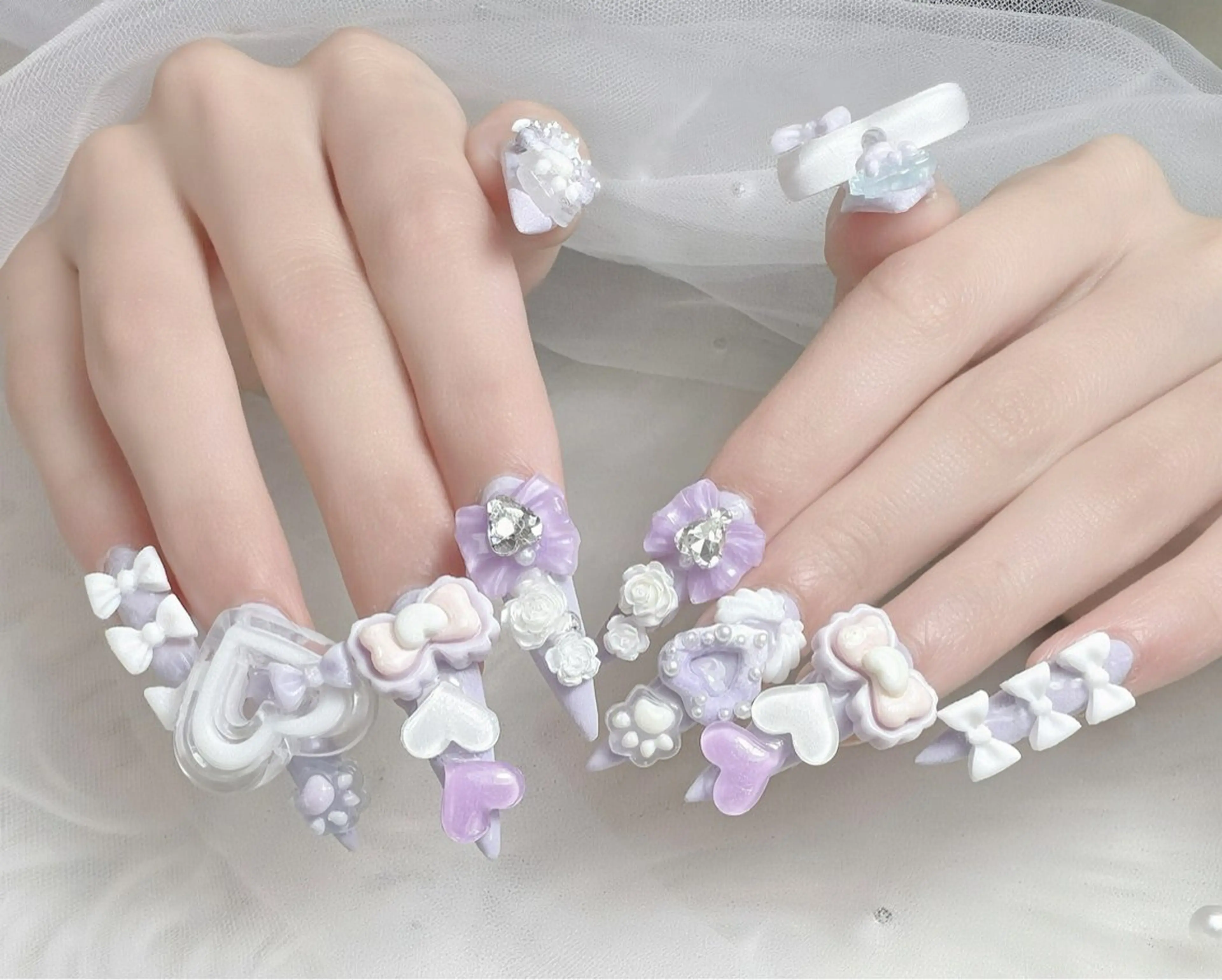 ネイル ハート パープル リボン ハンドネイル ハンドケア Gote Kawa nail salonのネイルデザイン