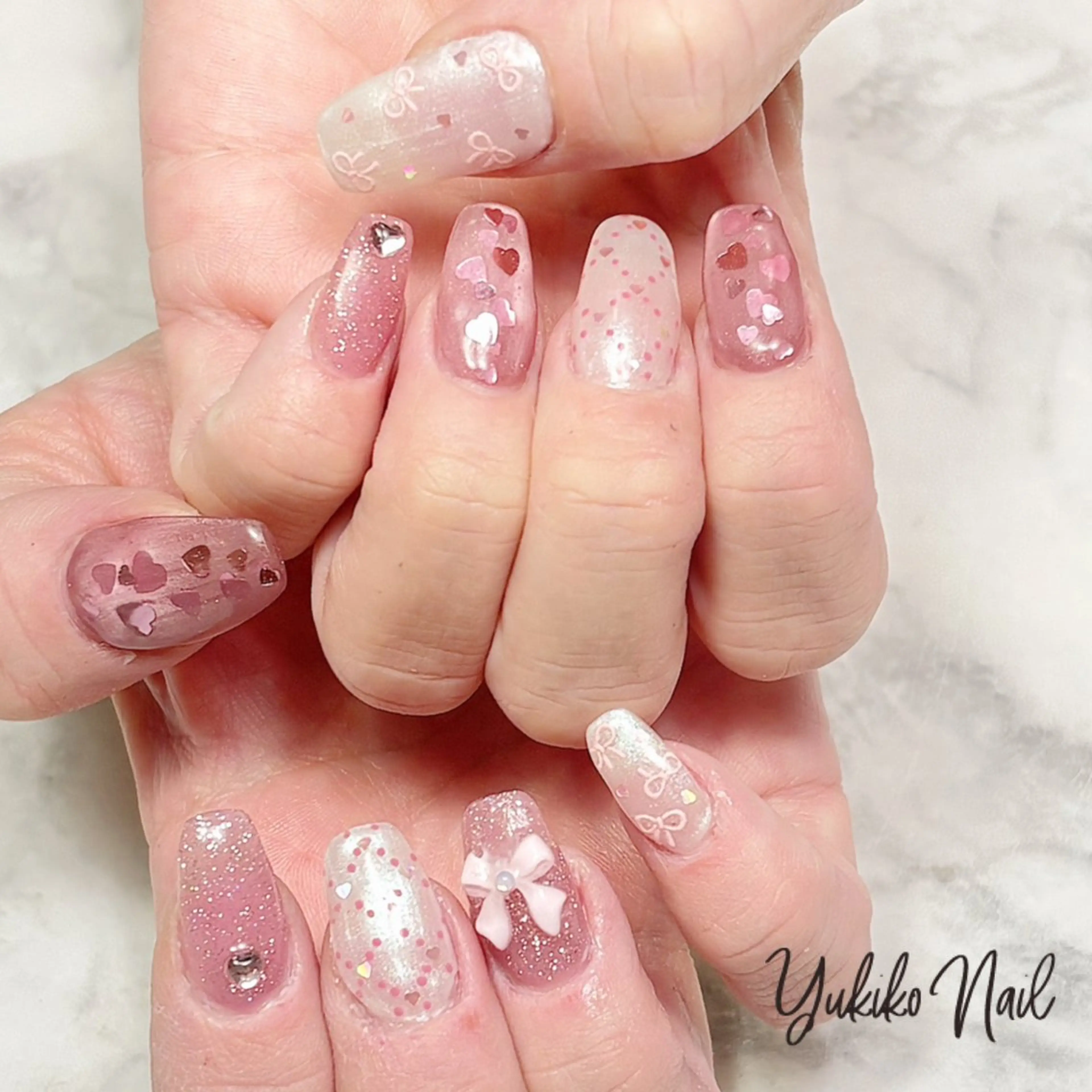 ネイル ハート ホログラムネイル マグネットネイル ピンク リボン ハンドネイル ユキコ ネイルのネイルデザイン