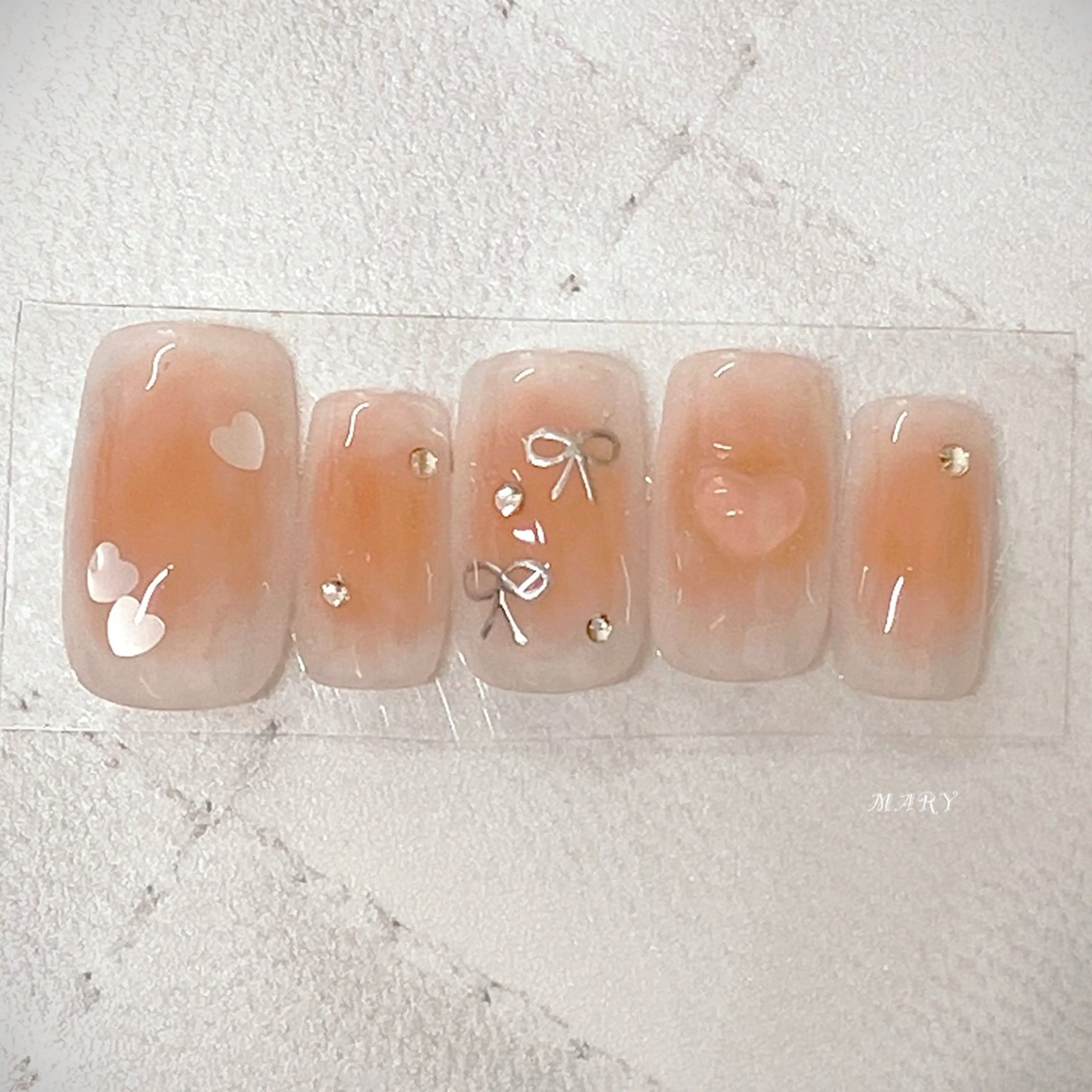 ネイル チークネイル ハート ニュアンスネイル ピンク リボン ハンドネイル Mary nail .narumiのネイルデザイン