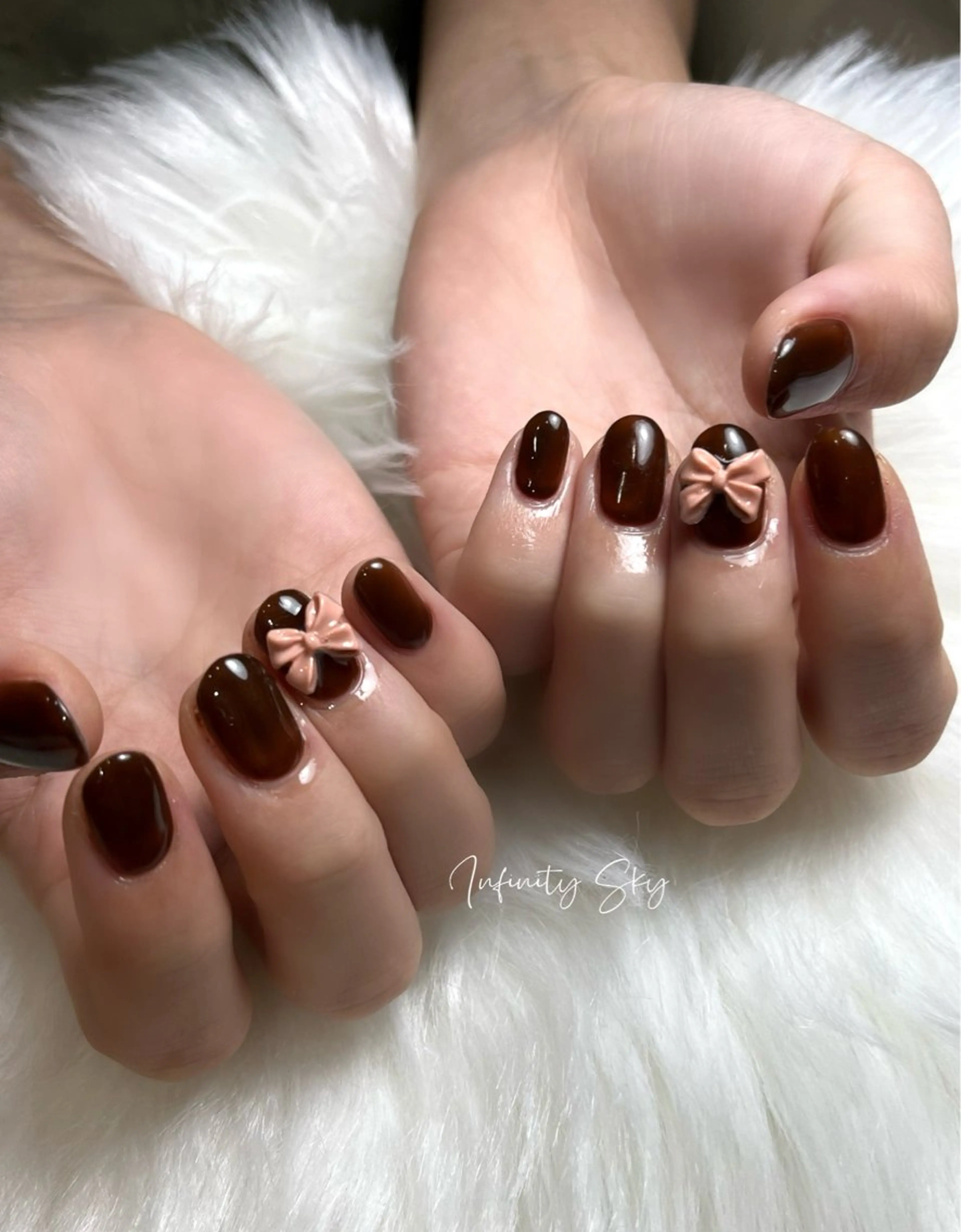 ネイル ブラウン リボン infinity skyのネイルデザイン