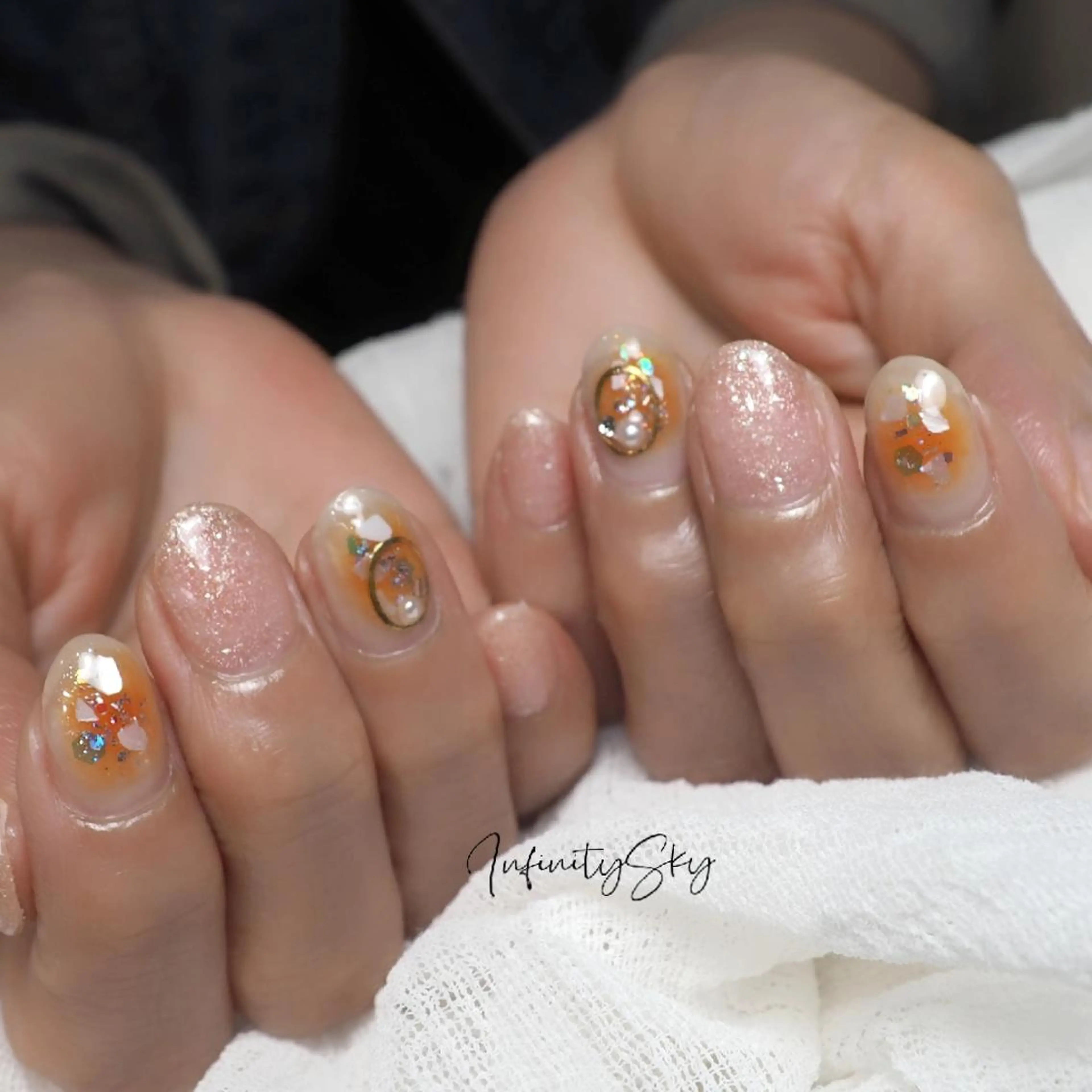 ネイル チークネイル オレンジ ハンドネイル infinity skyのネイルデザイン