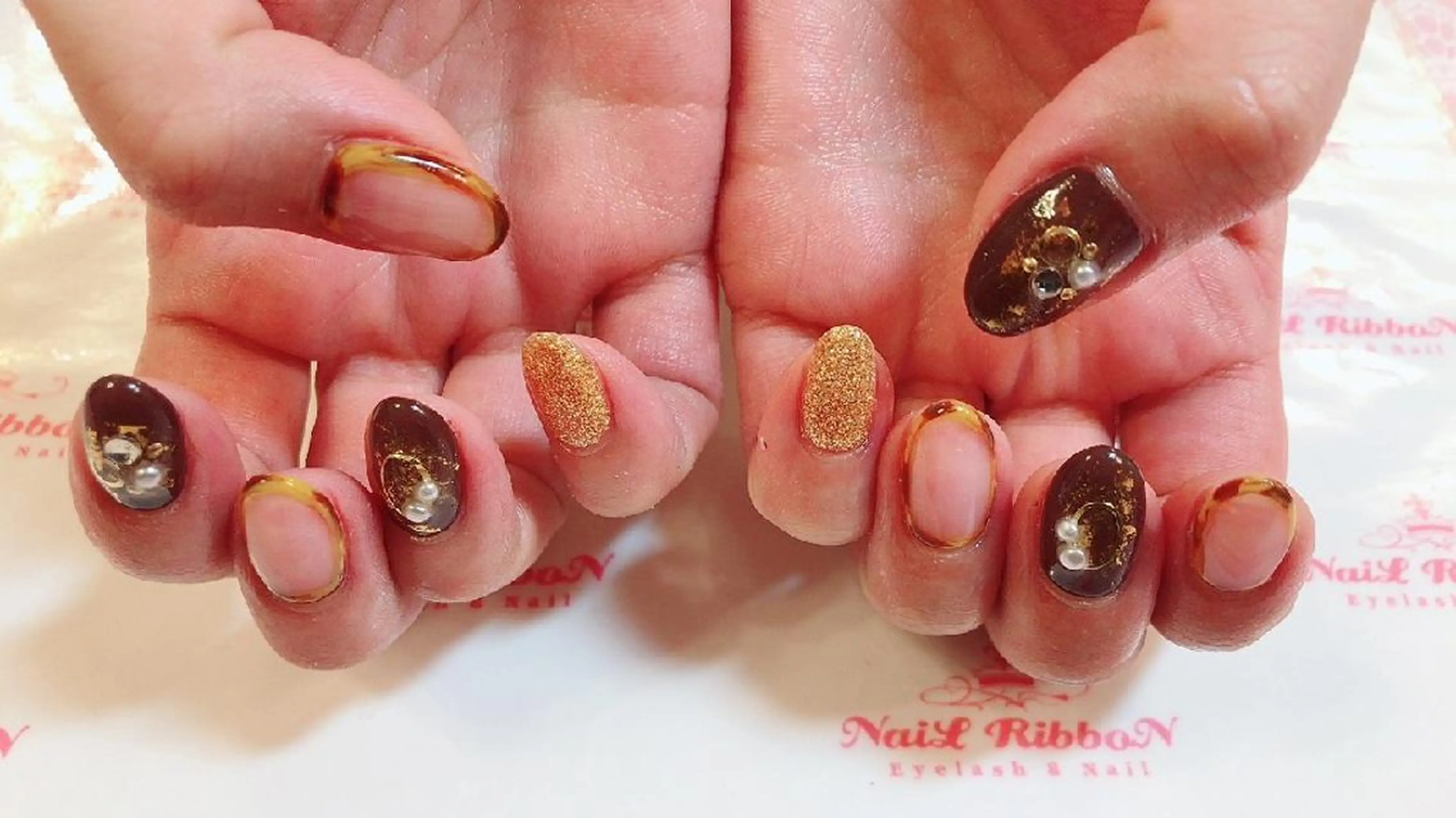 ネイル ネイルリボン 受付スタッフのネイルデザイン