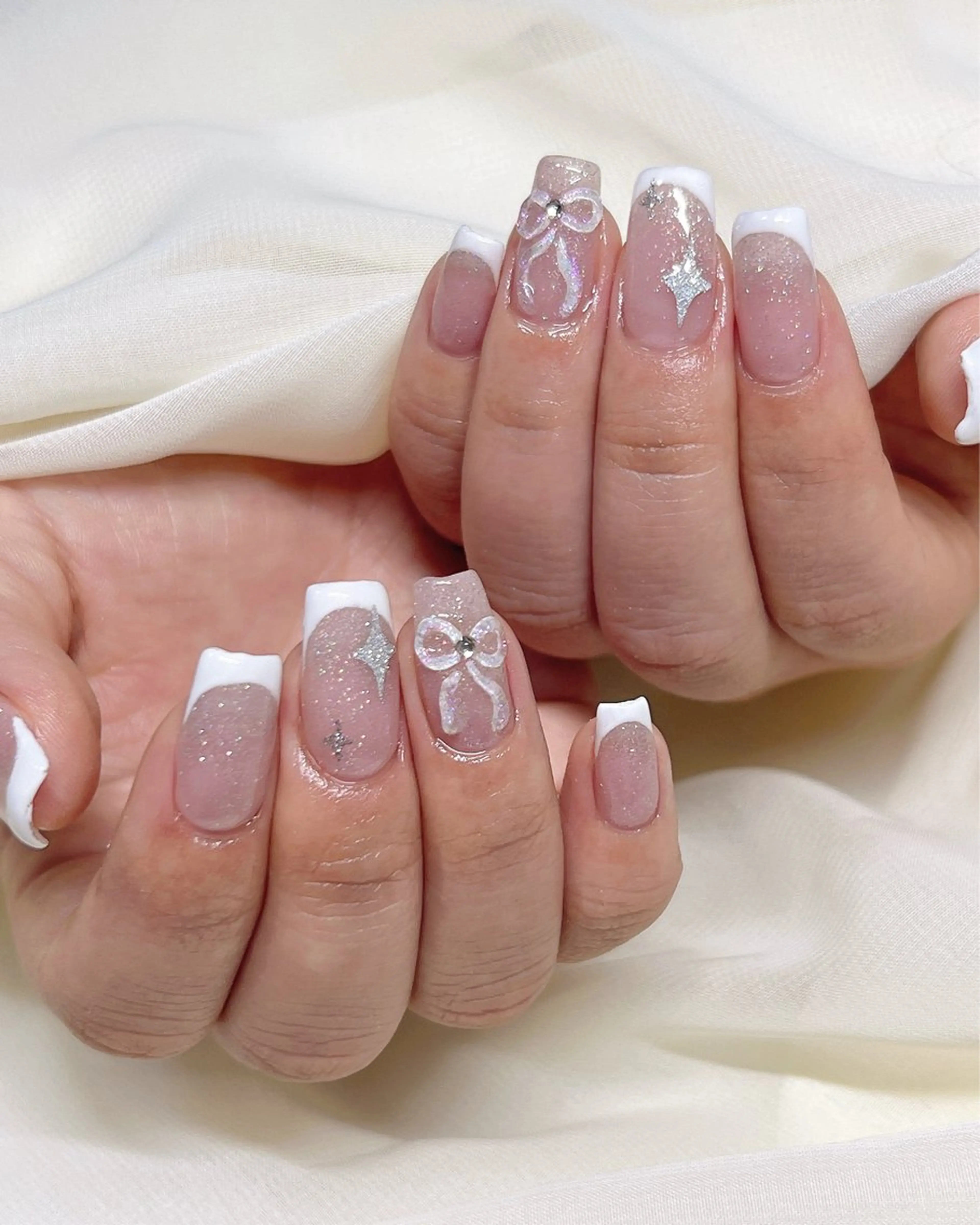 ネイル アートネイル キラキラネイル ピンク リボン nail salon MUAのネイルデザイン