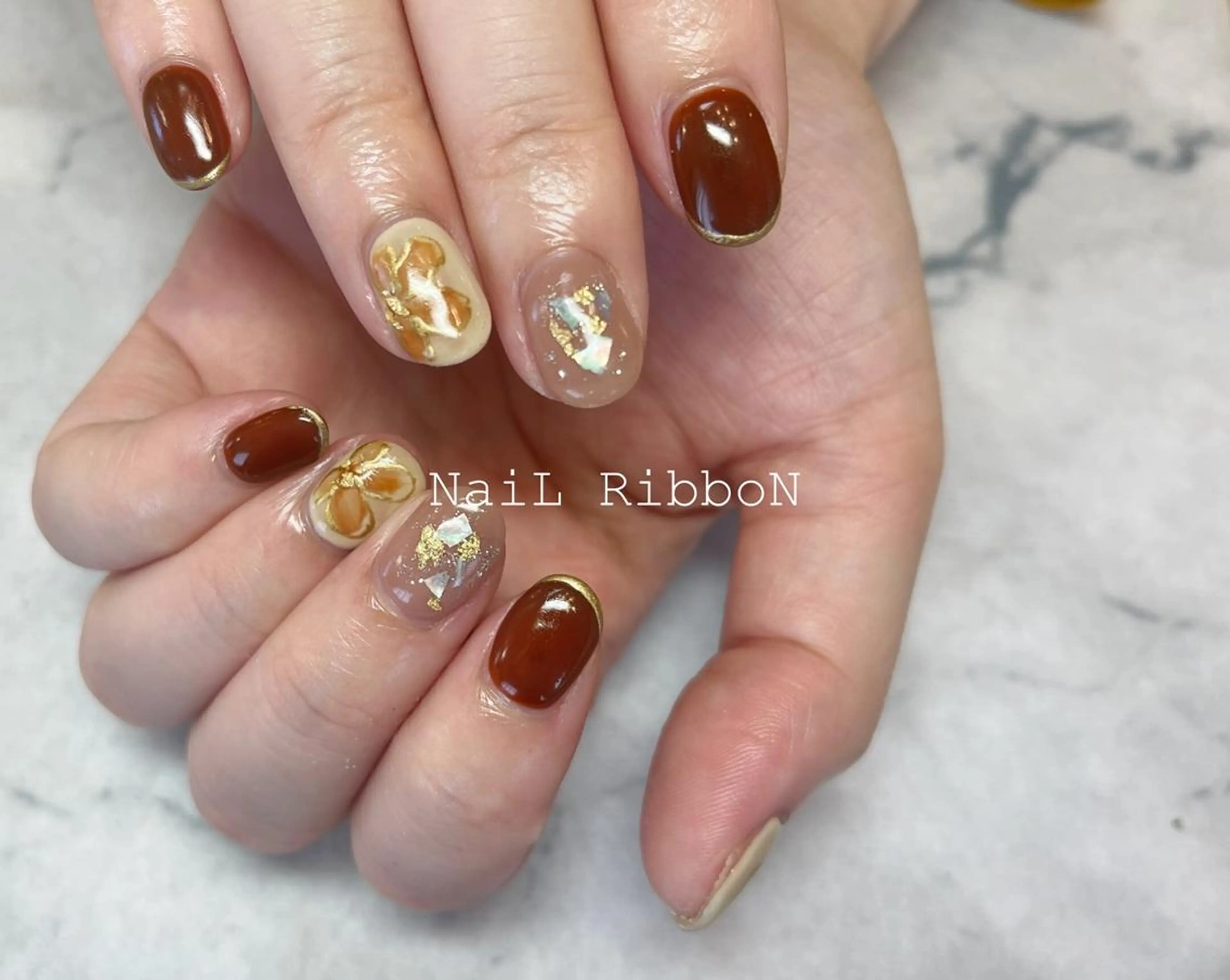 ネイル ネイルリボン 受付スタッフのネイルデザイン