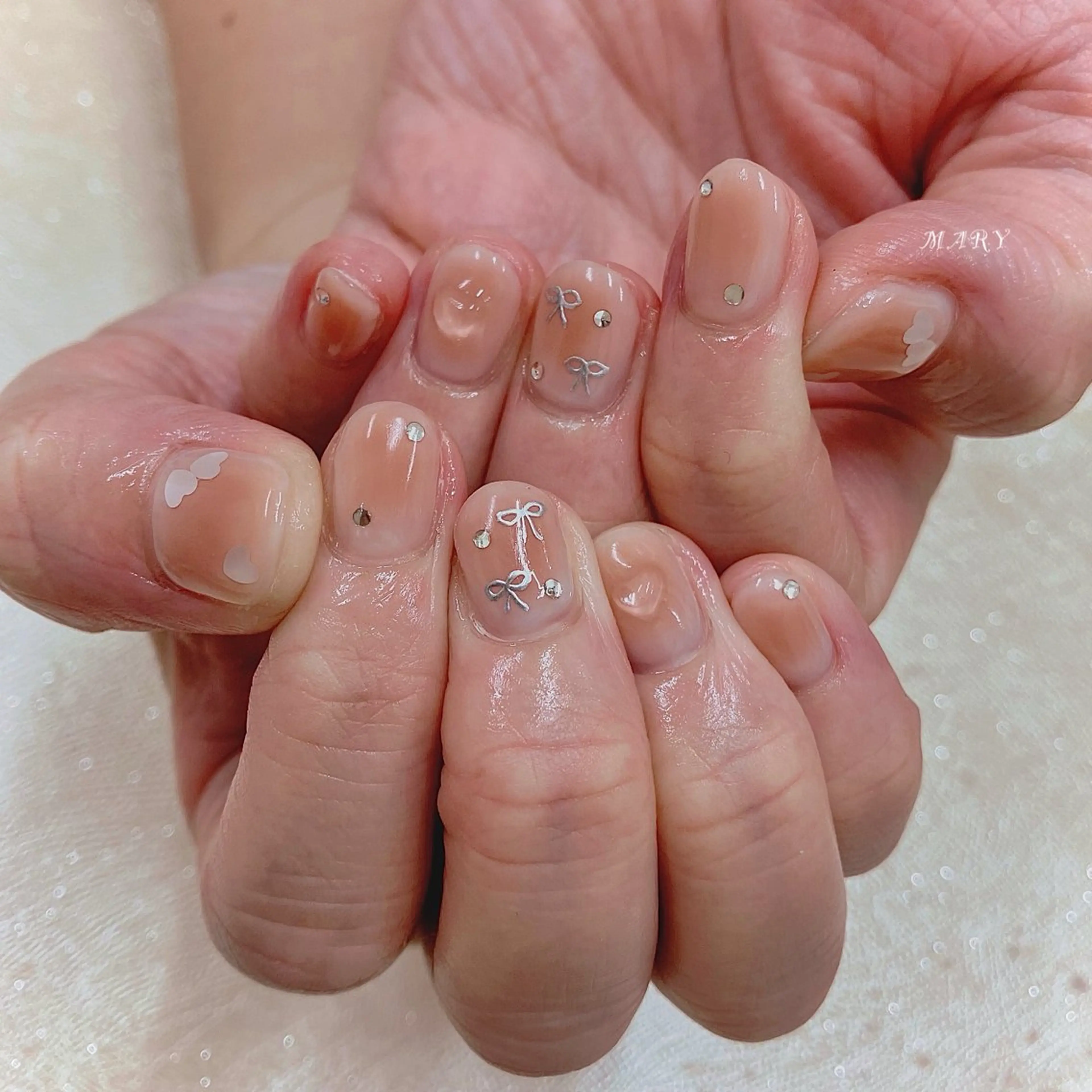 ネイル チークネイル ハート ニュアンスネイル ピンク リボン ハンドネイル Mary nail .narumiのネイルデザイン