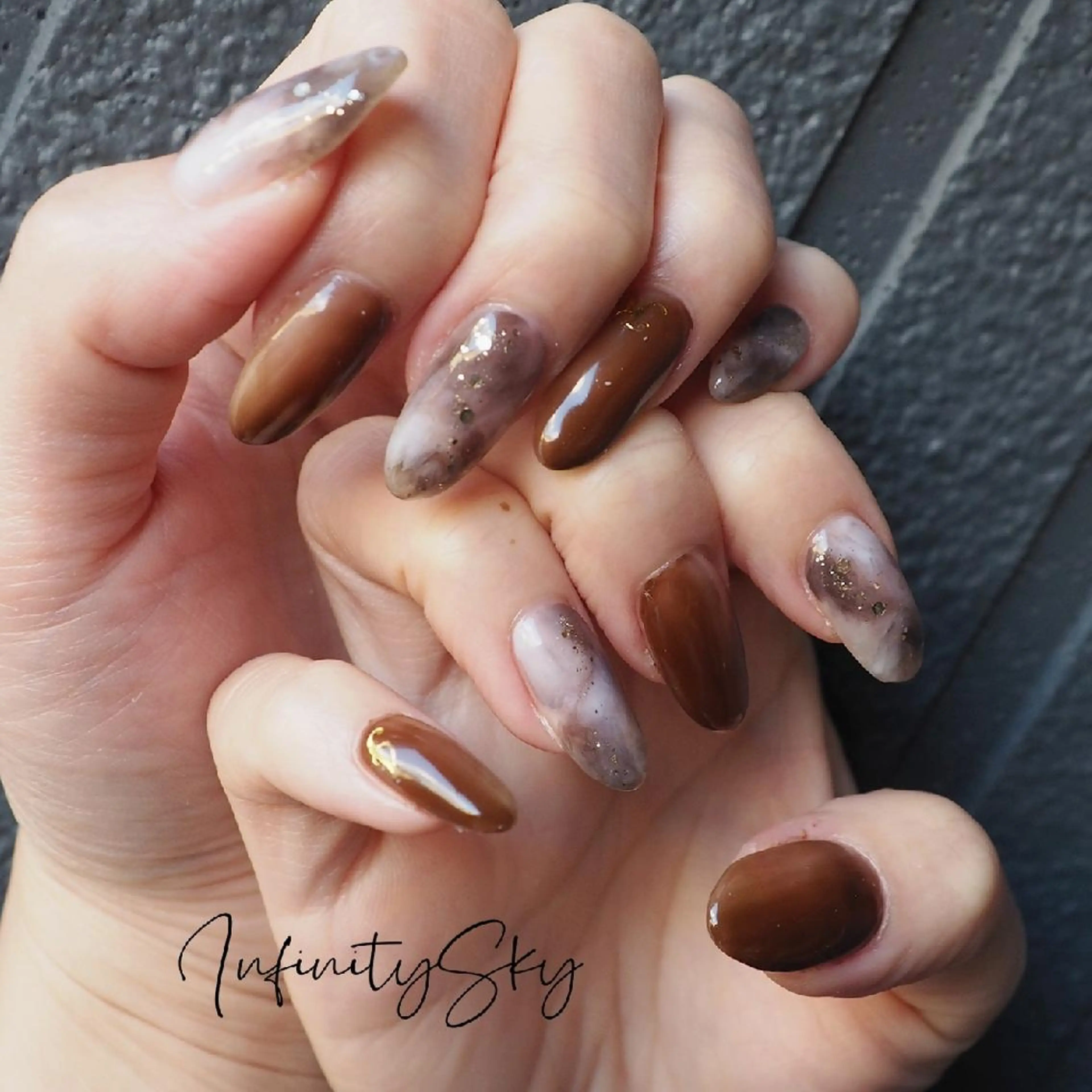 ネイル ブラウン ニュアンスネイル infinity skyのネイルデザイン