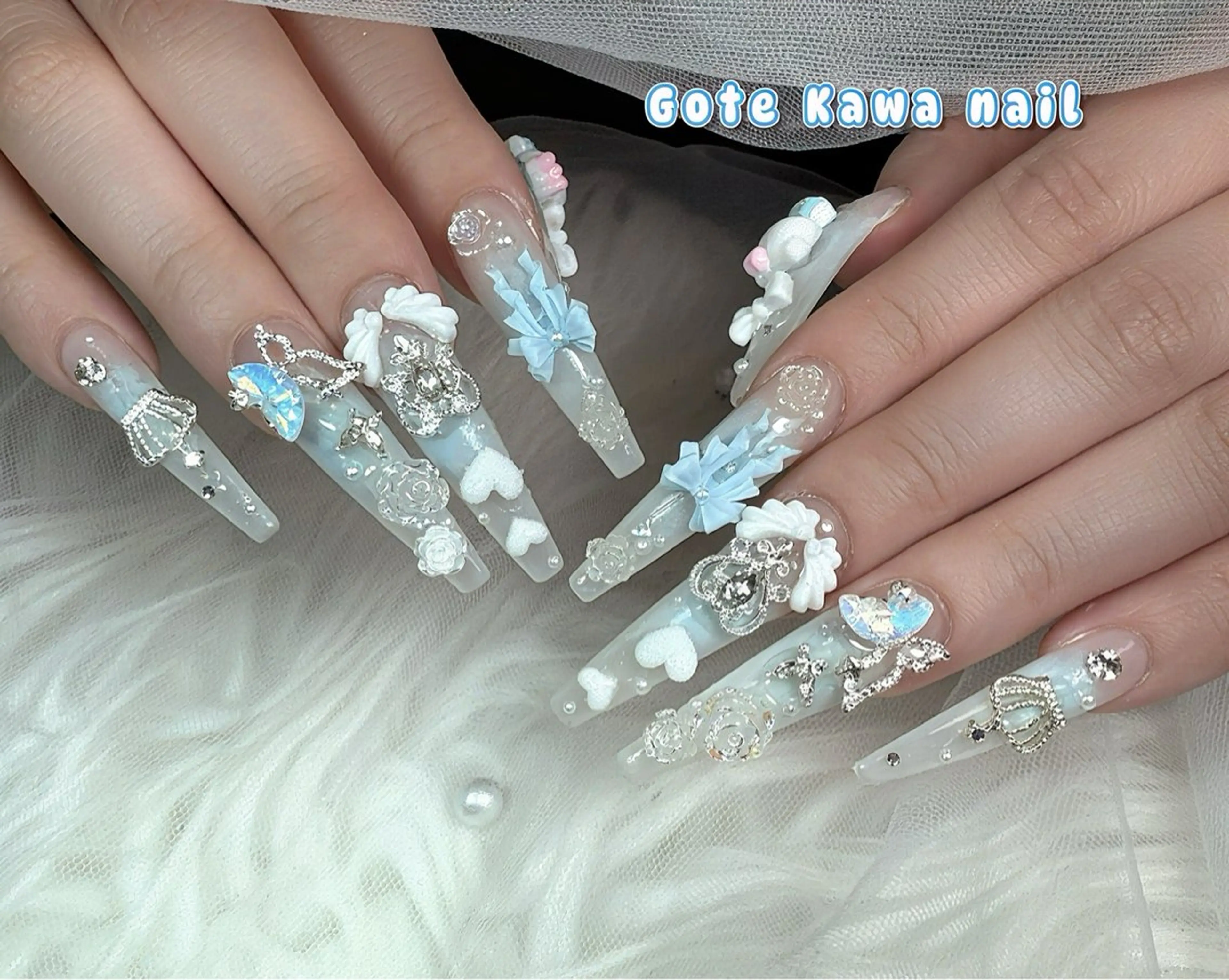 ネイル チークネイル クリアネイル ハート 水色 リボン ハンドネイル ハンドケア Gote Kawa nail salonのネイルデザイン