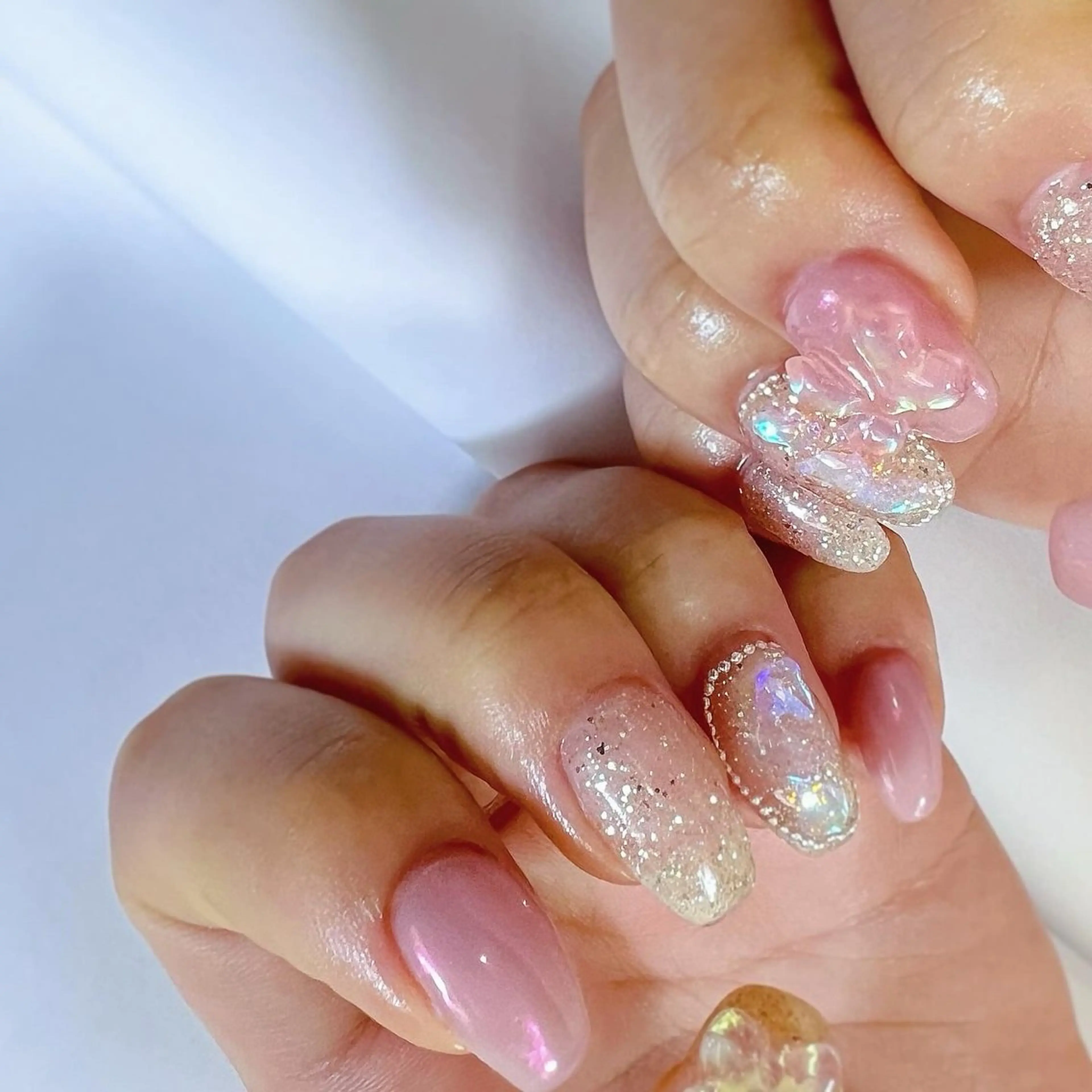 ネイル オーロラネイル ピンク リボン スクエアネイル 冬ネイル ハンドネイル pointillé .ayaのネイルデザイン