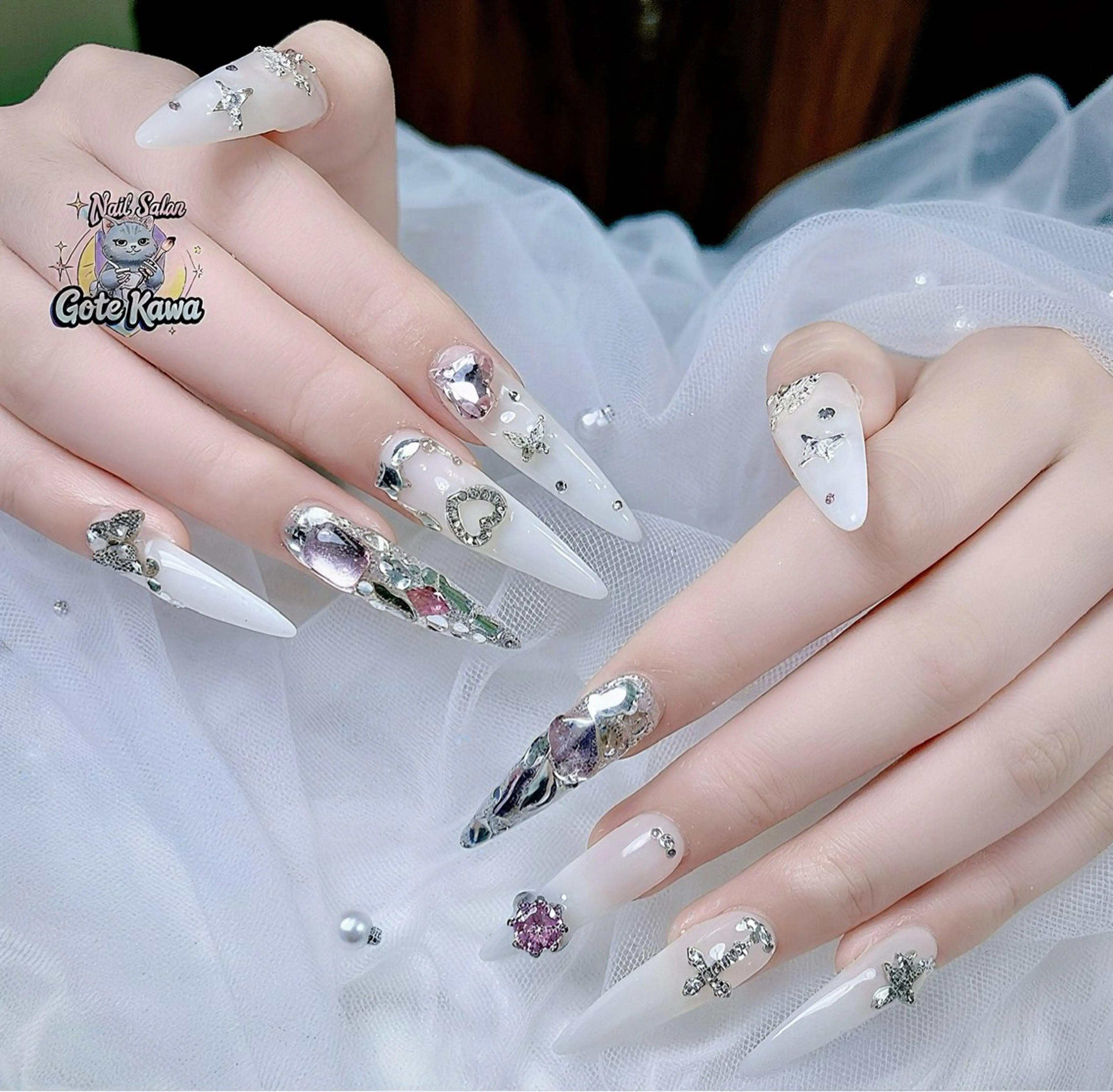 ネイル アートネイル 長さ出し キラキラネイル ピンク リボン Gote Kawa nail salonのネイルデザイン