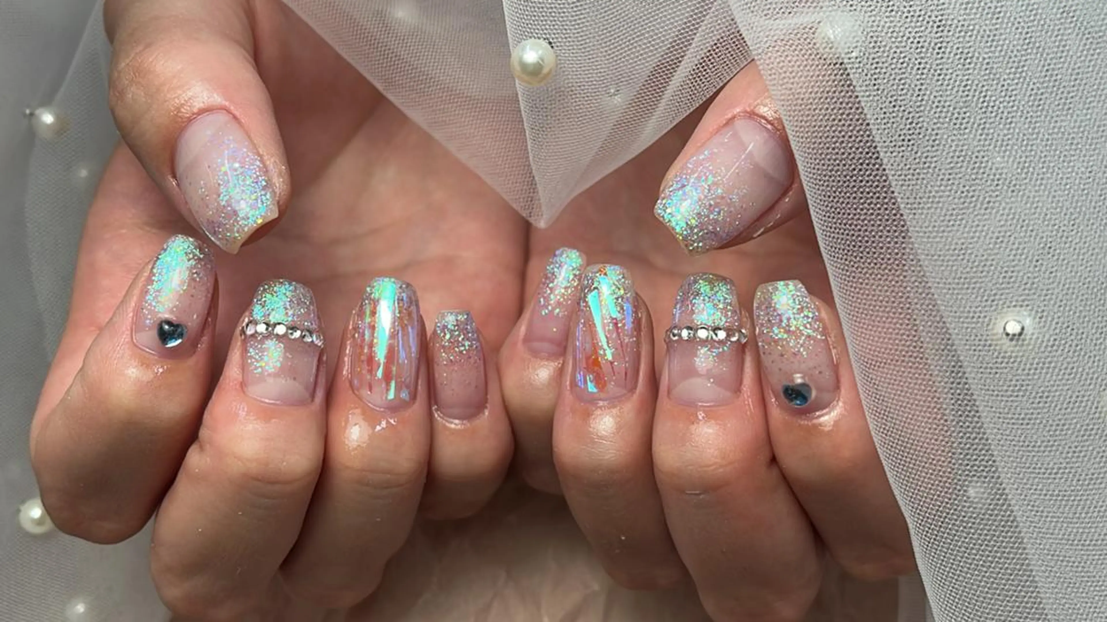 ネイル ブルー ゴージャス ハート ホログラムネイル キラキラネイル ハンドネイル ToliyDeliy Nail Salonのネイルデザイン