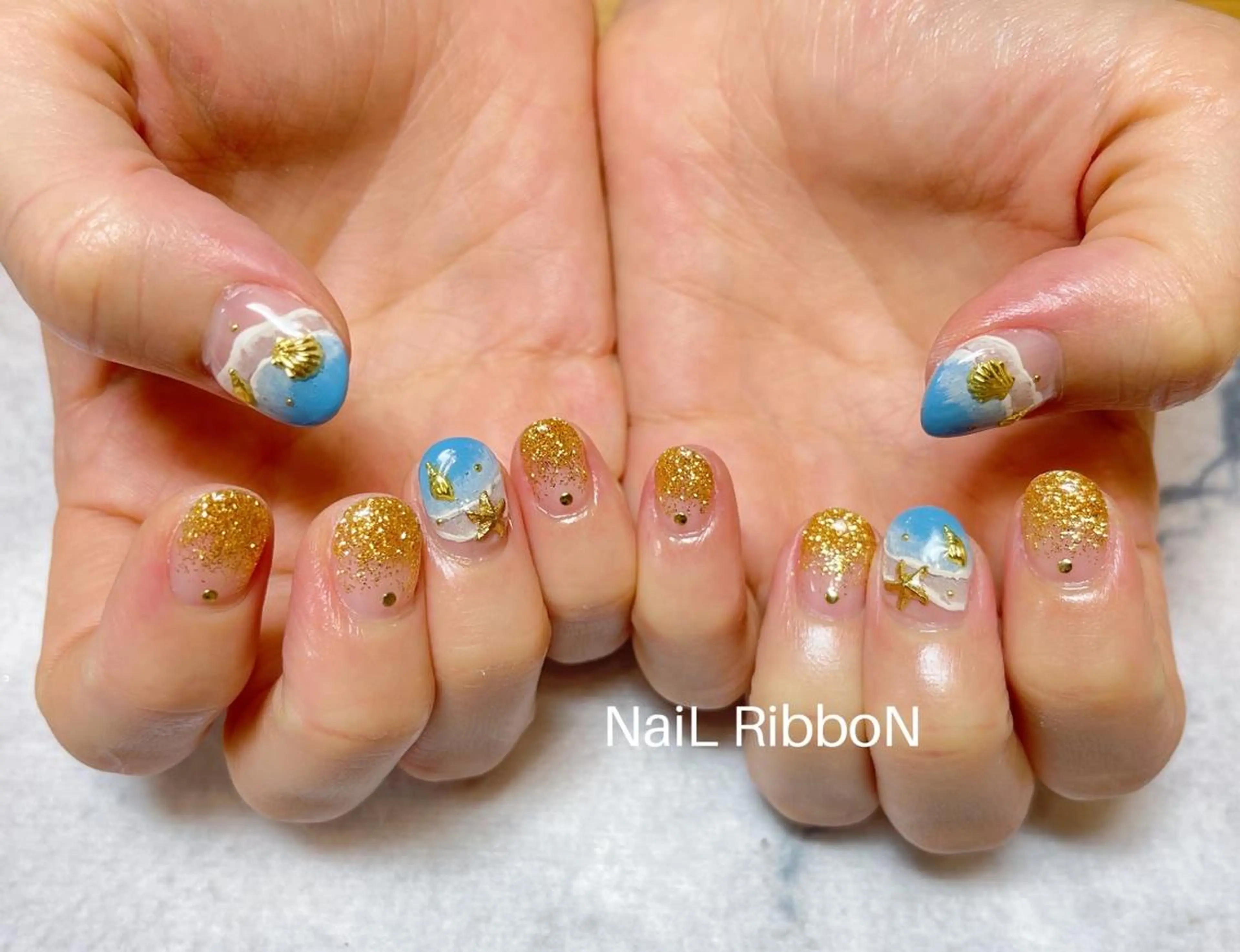 ネイル ネイルリボン 受付スタッフのネイルデザイン