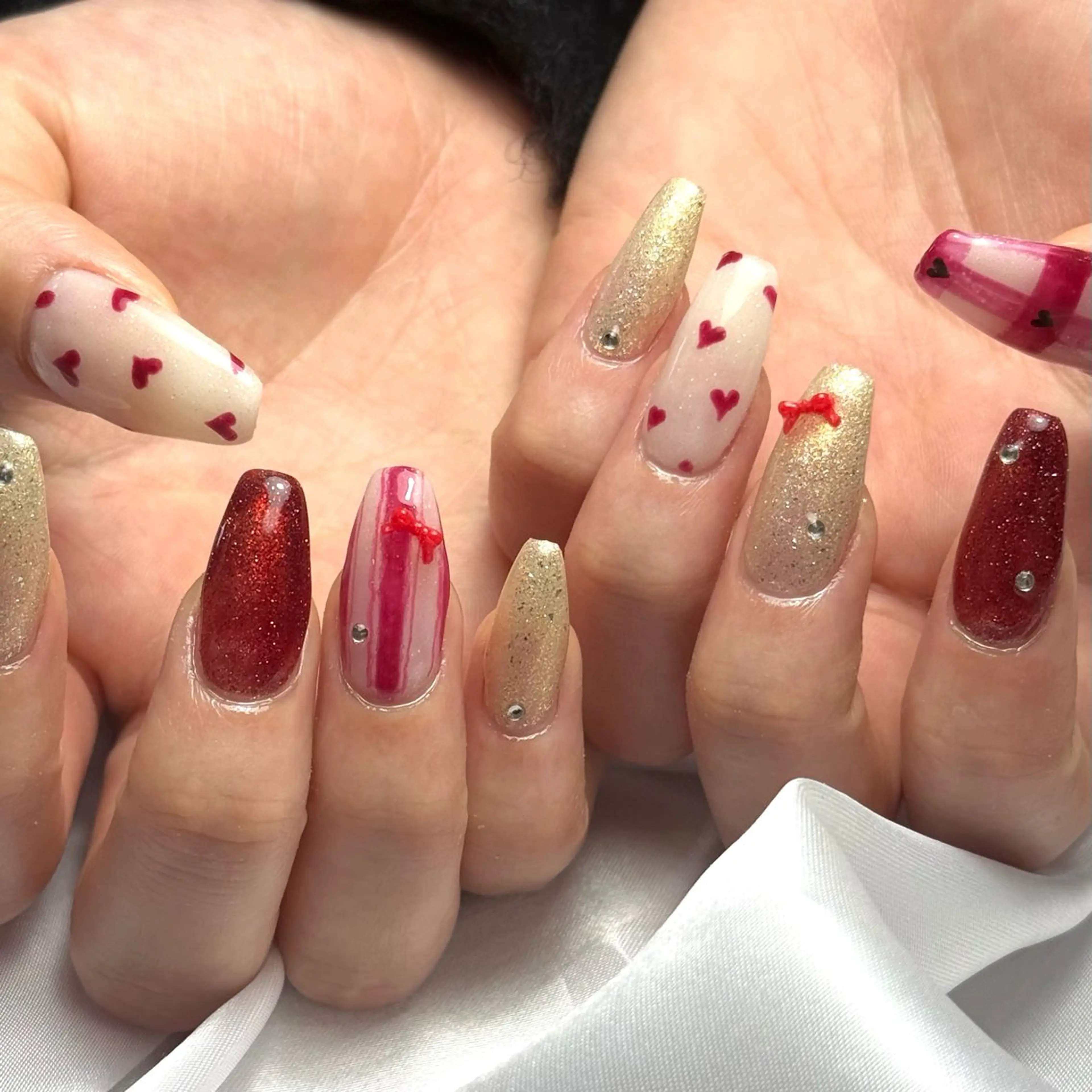 ネイル ガーリー ハート リボン Ray nail natsu🎀のネイルデザイン