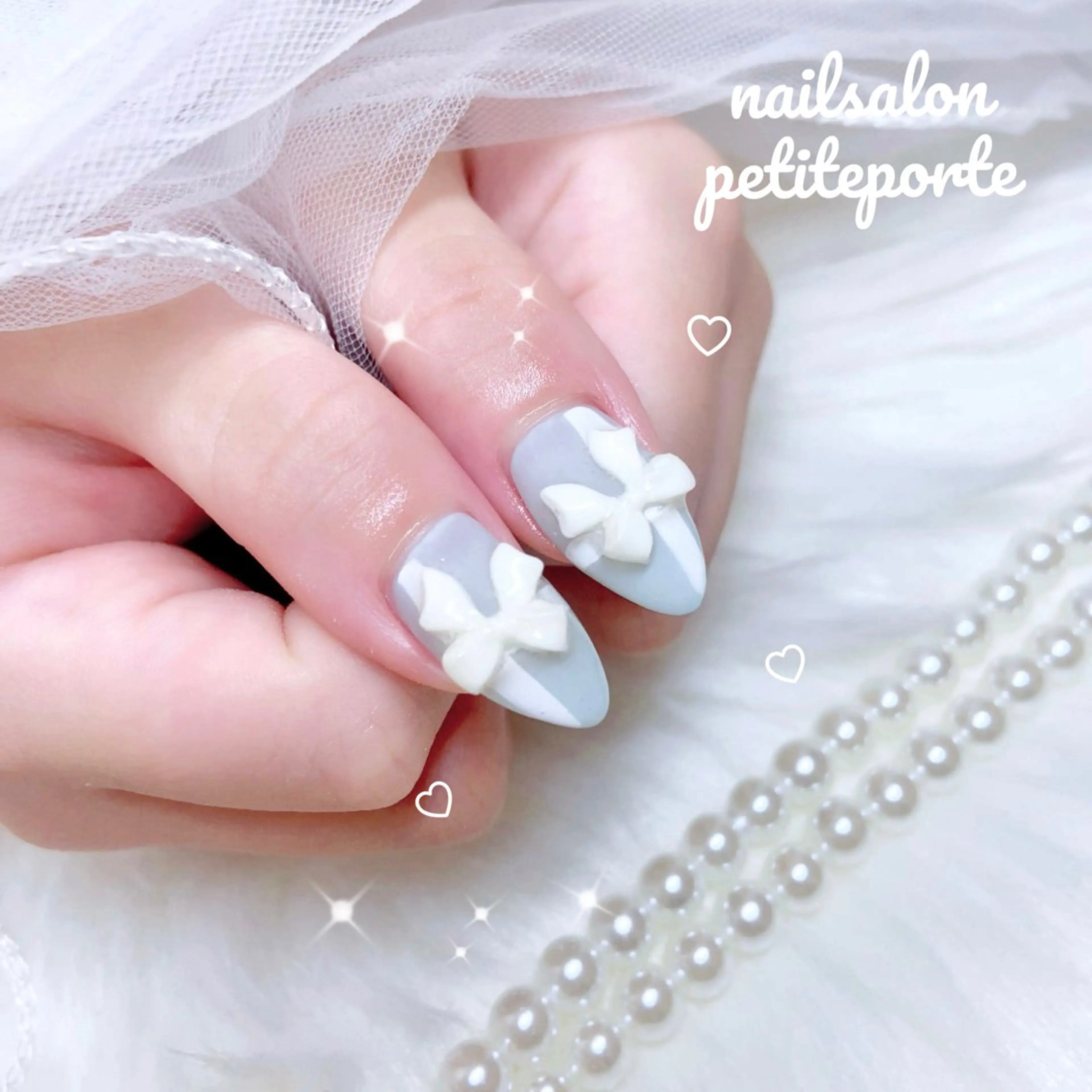 ネイル ブルー 水色 リボン ハンドネイル petite porteのネイルデザイン