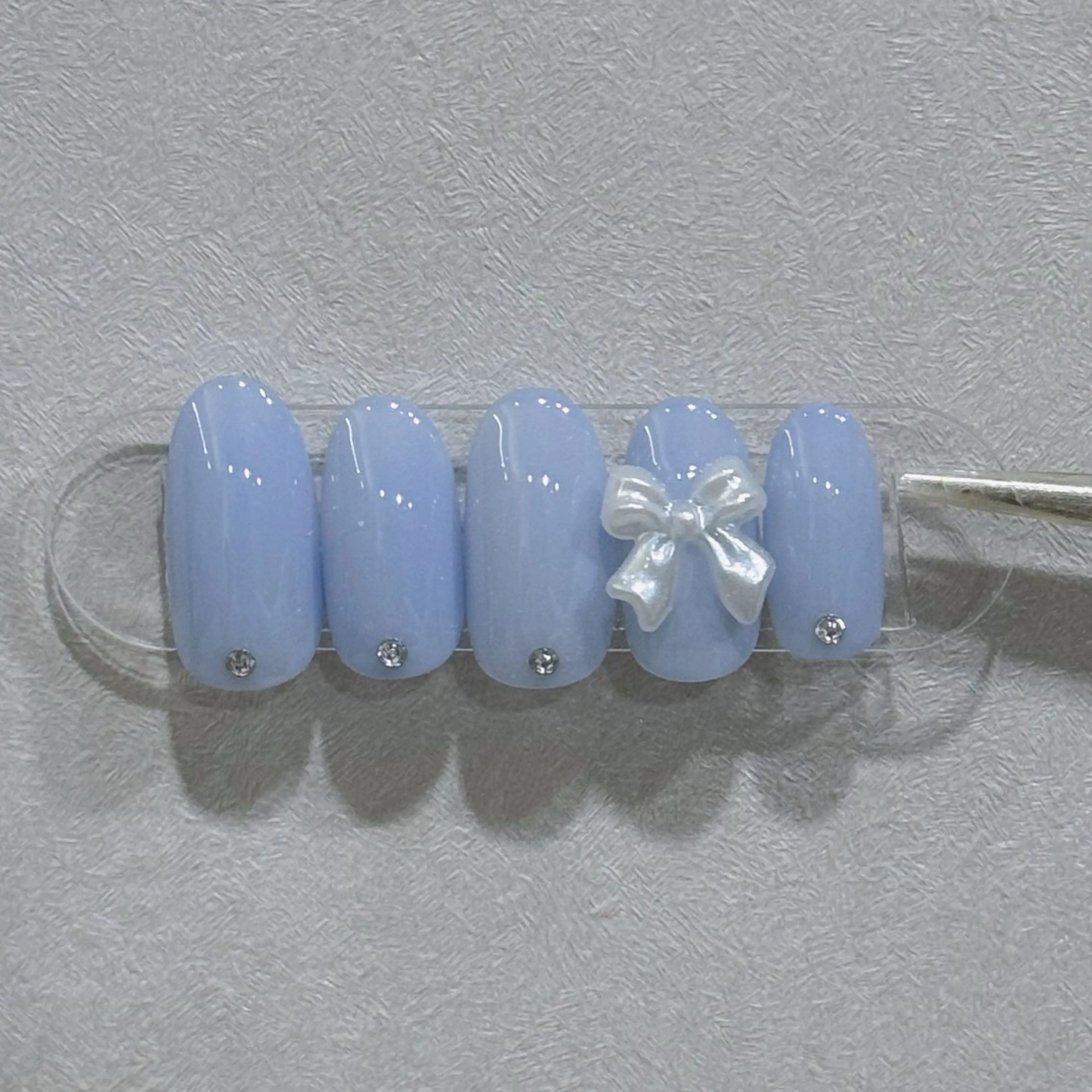 ネイル ガーリー 水色 リボン ハンドネイル 韓国ネイル/ワンホン ネイル🎀表参道3分のネイルデザイン