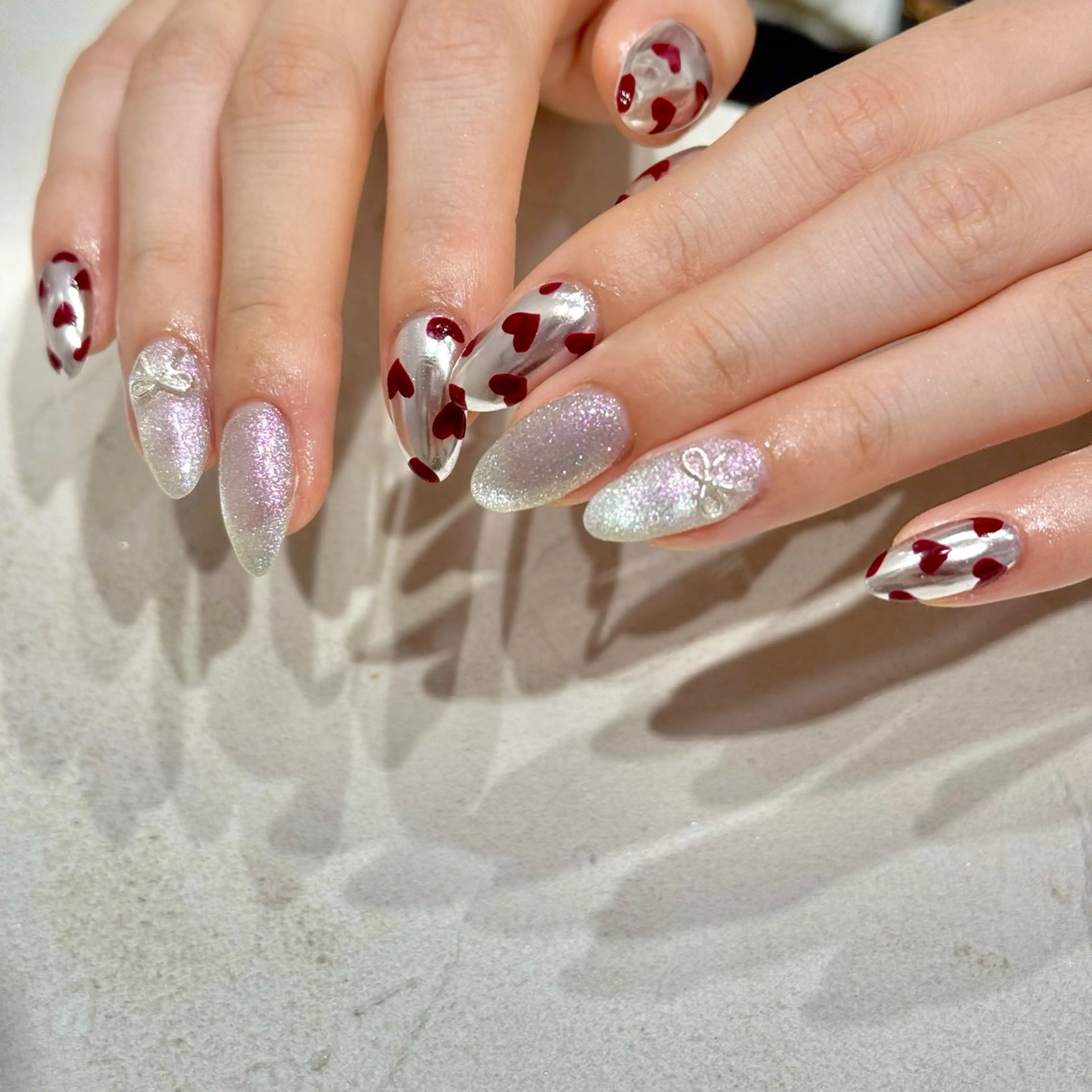 ネイル ハート マグネットネイル ミラーネイル リボン ハンドネイル Bianca YAMADA☺︎のネイルデザイン