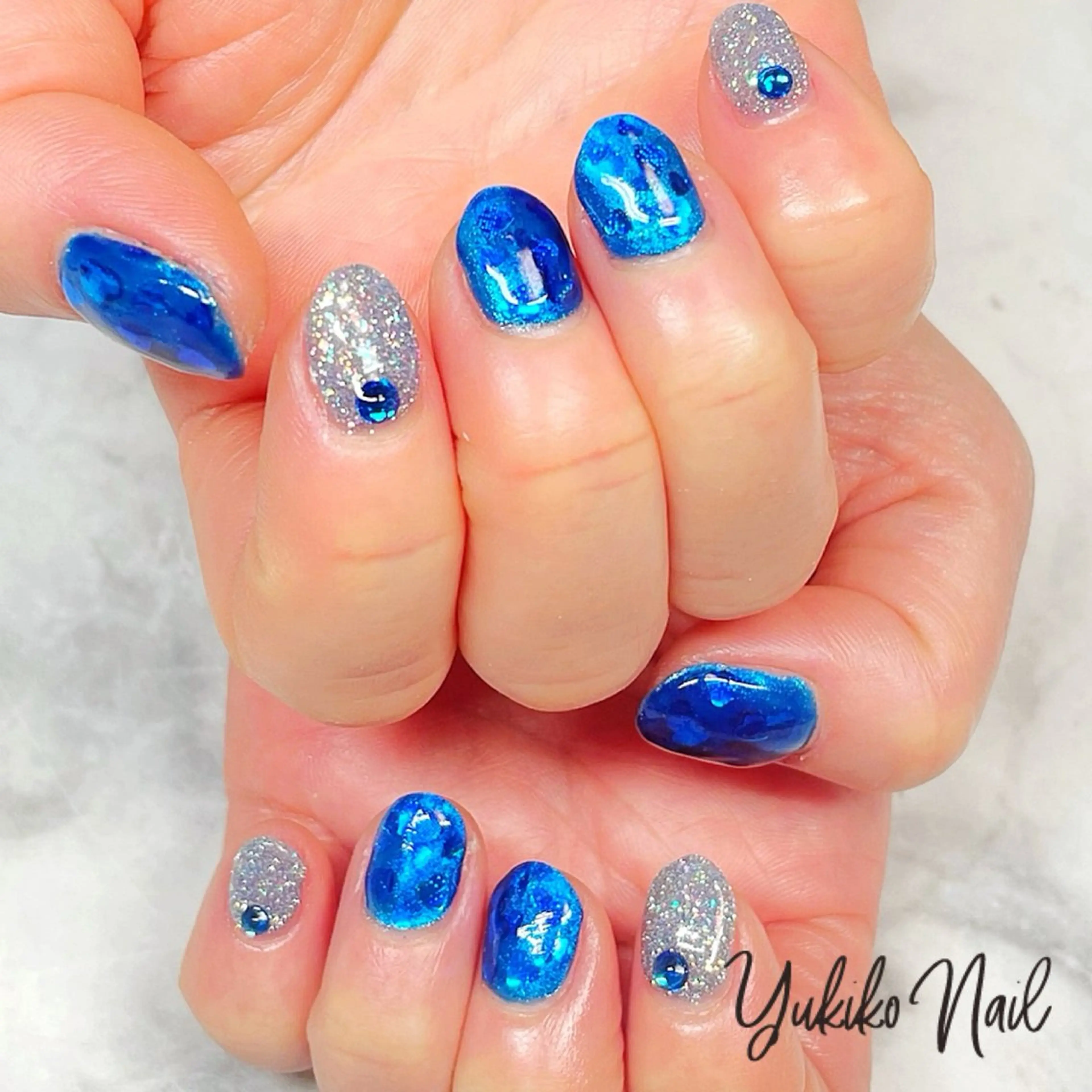 ネイル ブルー フラッシュネイル ハート ホログラムネイル キラキラネイル ハンドネイル ユキコ ネイルのネイルデザイン