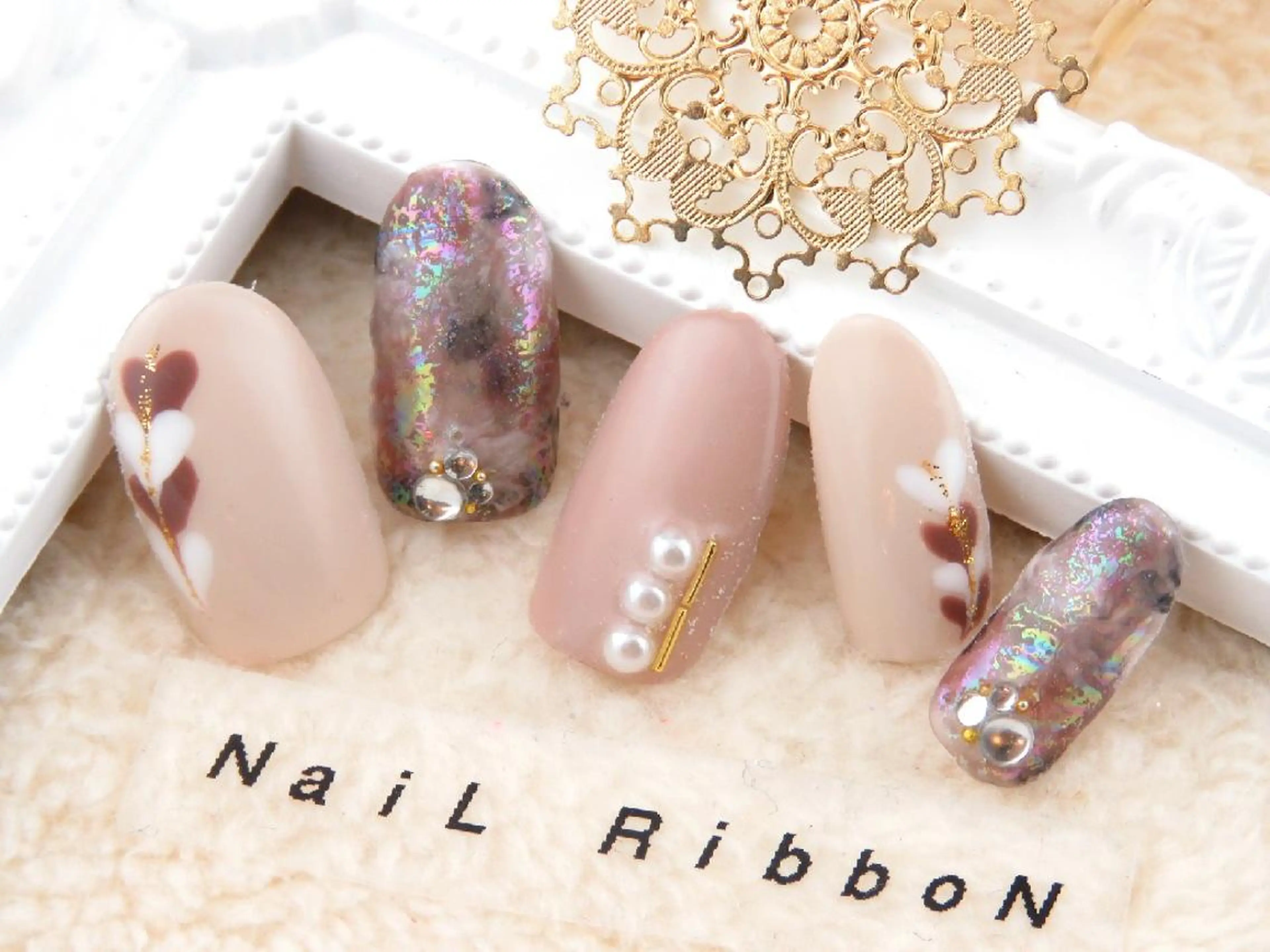 ネイル ネイルリボン 受付スタッフのネイルデザイン