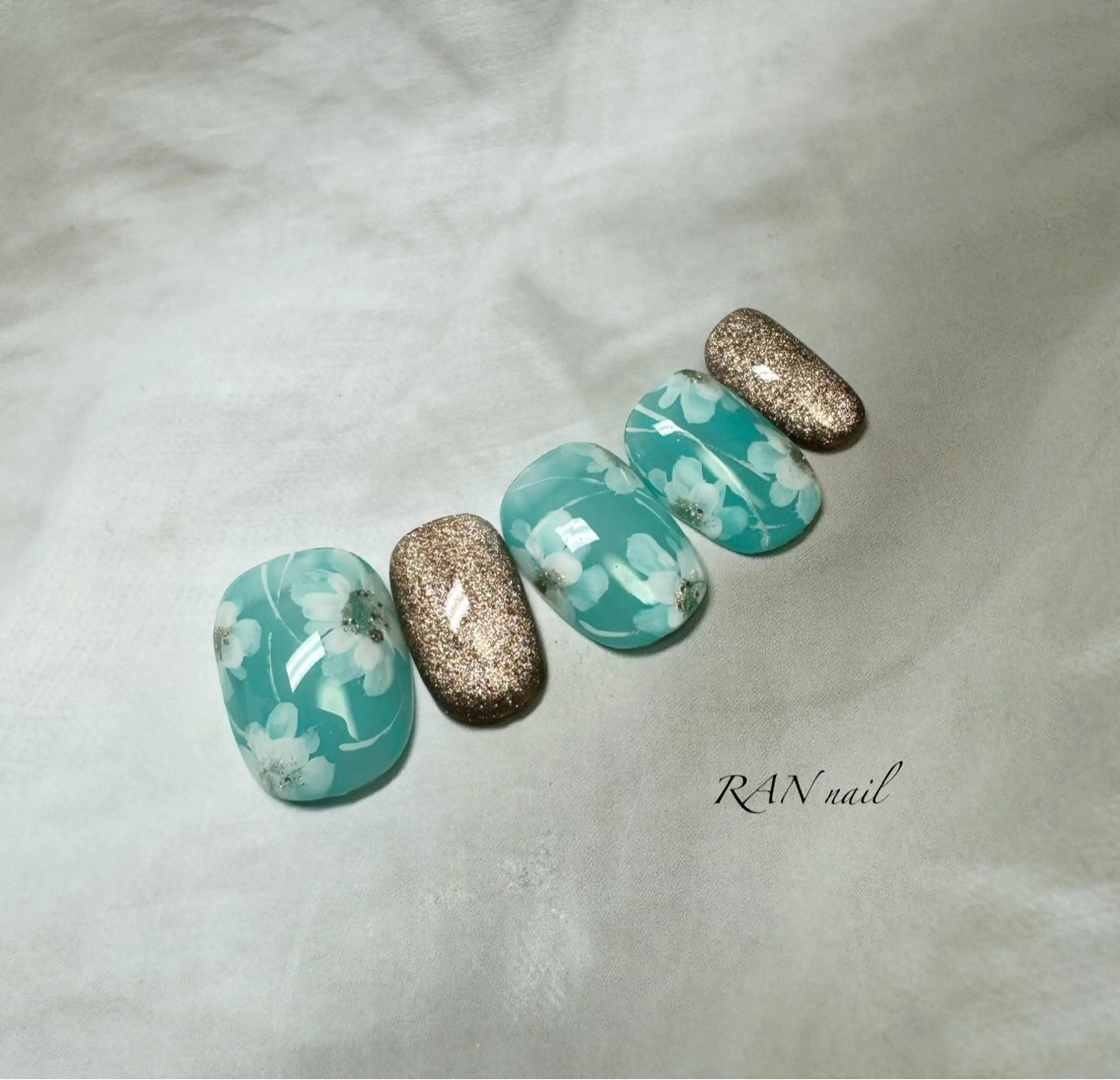 ネイル ブルー ブラウン 桜ネイル 入学式 フラワーネイル ハンドネイル フットネイル RAN nailのネイルデザイン