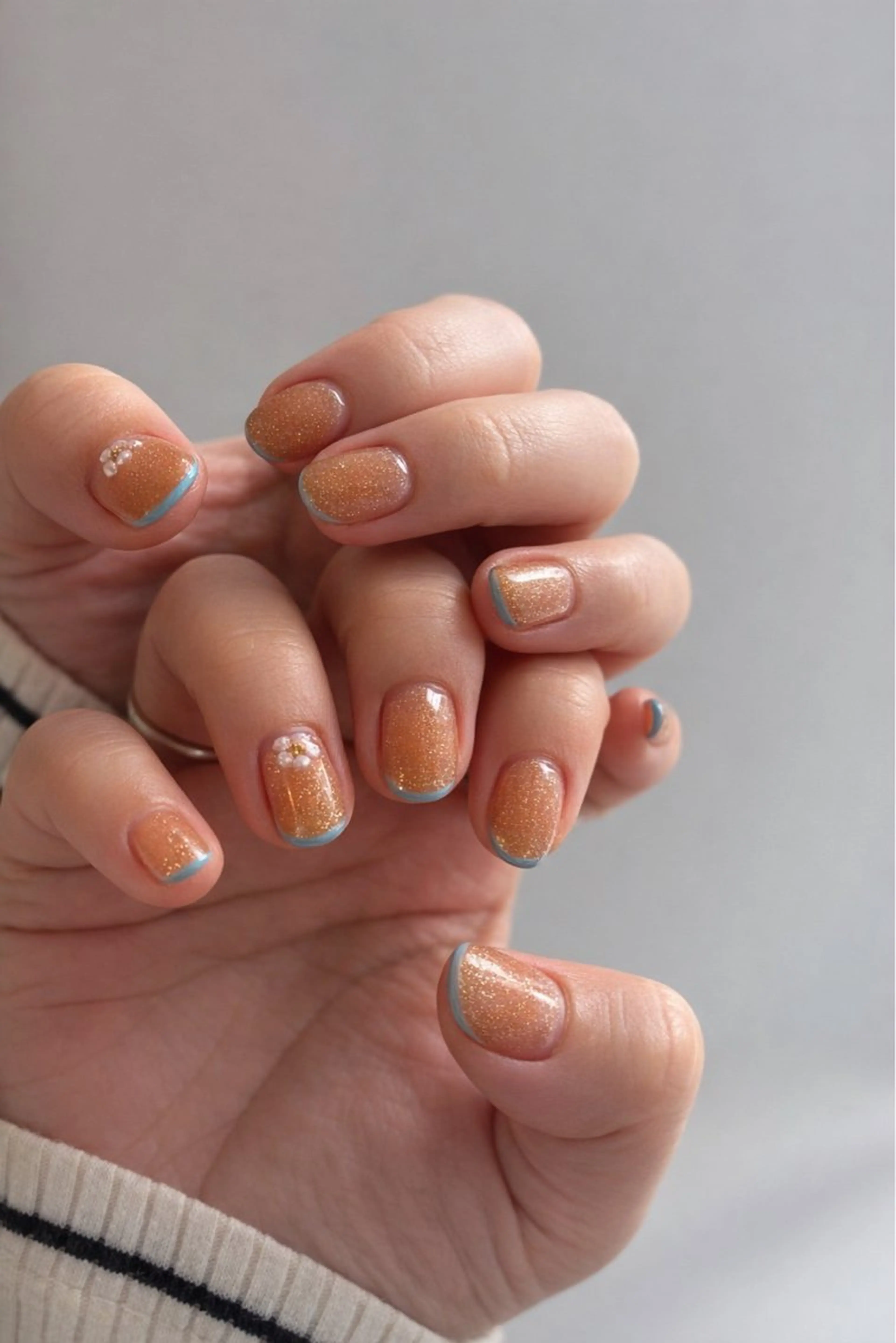ネイル 水色 オレンジ ハンドネイル Elio 国泰寺のネイルデザイン