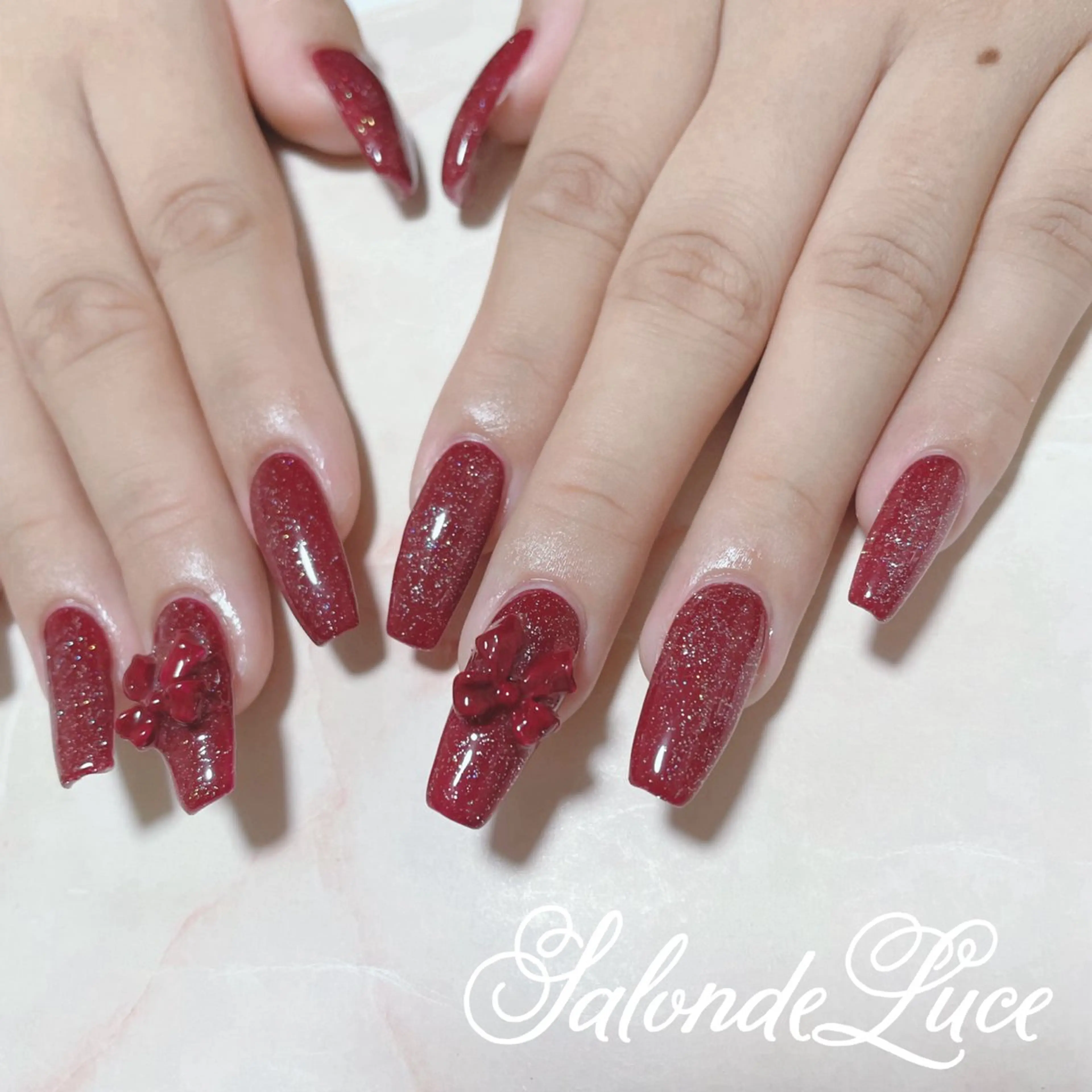 ネイル キラキラネイル リボン Salon de Luceのネイルデザイン