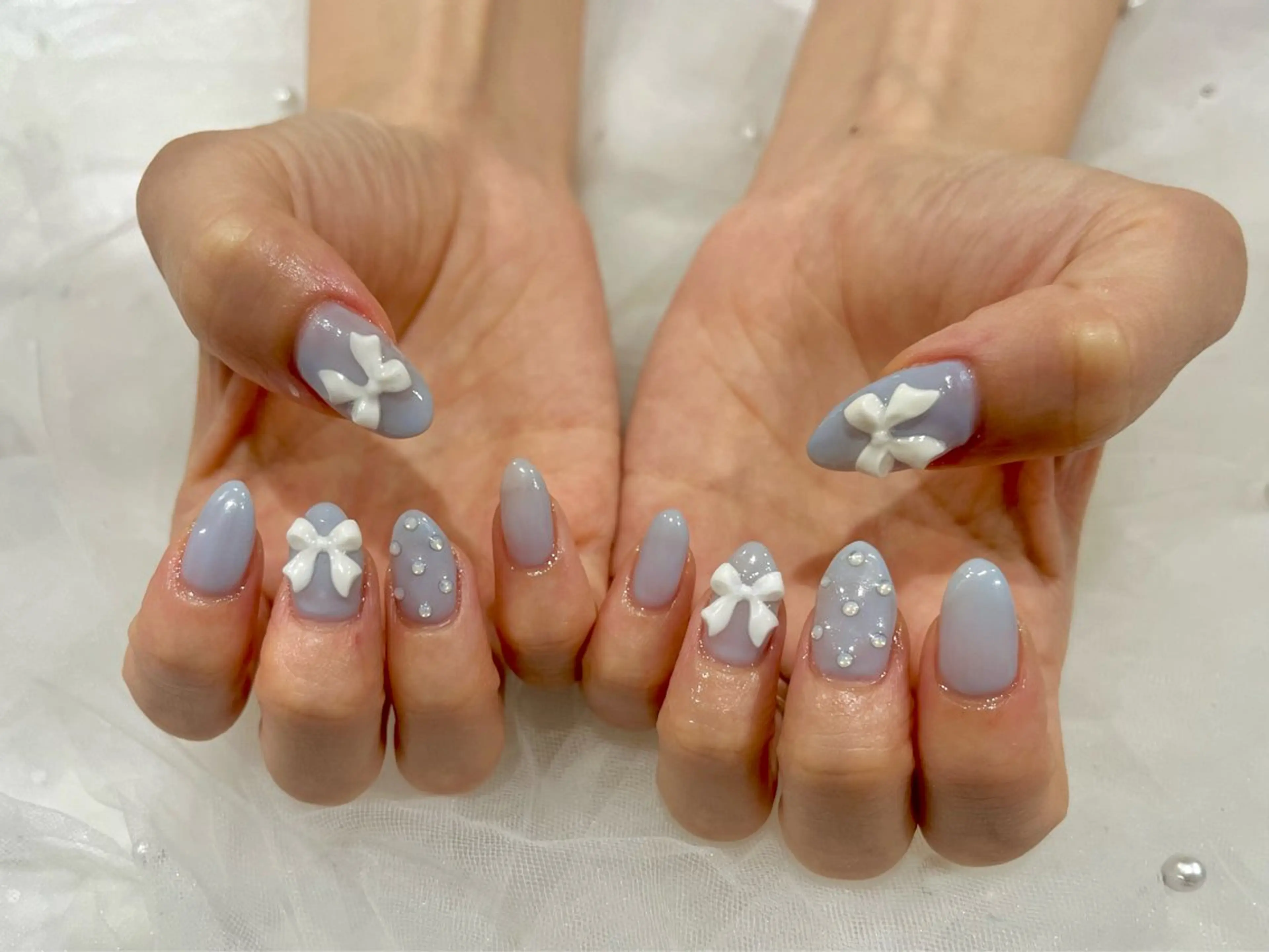 ネイル ブルー リボン ホワイト ハンドネイル Nail salon Cielel⟡Ayaのネイルデザイン