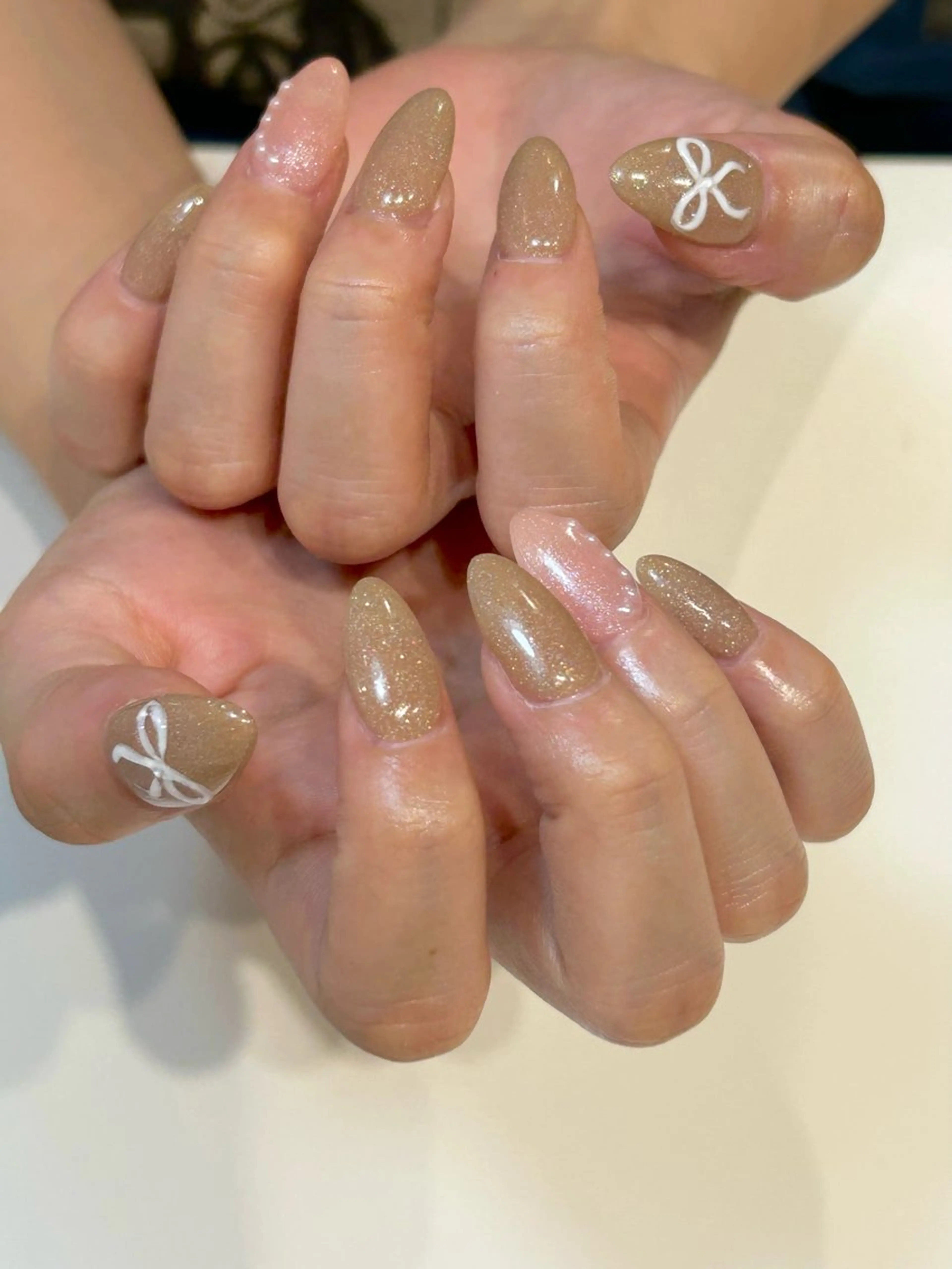 ネイル キラキラネイル オフィスネイル ピンク ピンクベージュ リボン ハンドネイル Lily nailのネイルデザイン