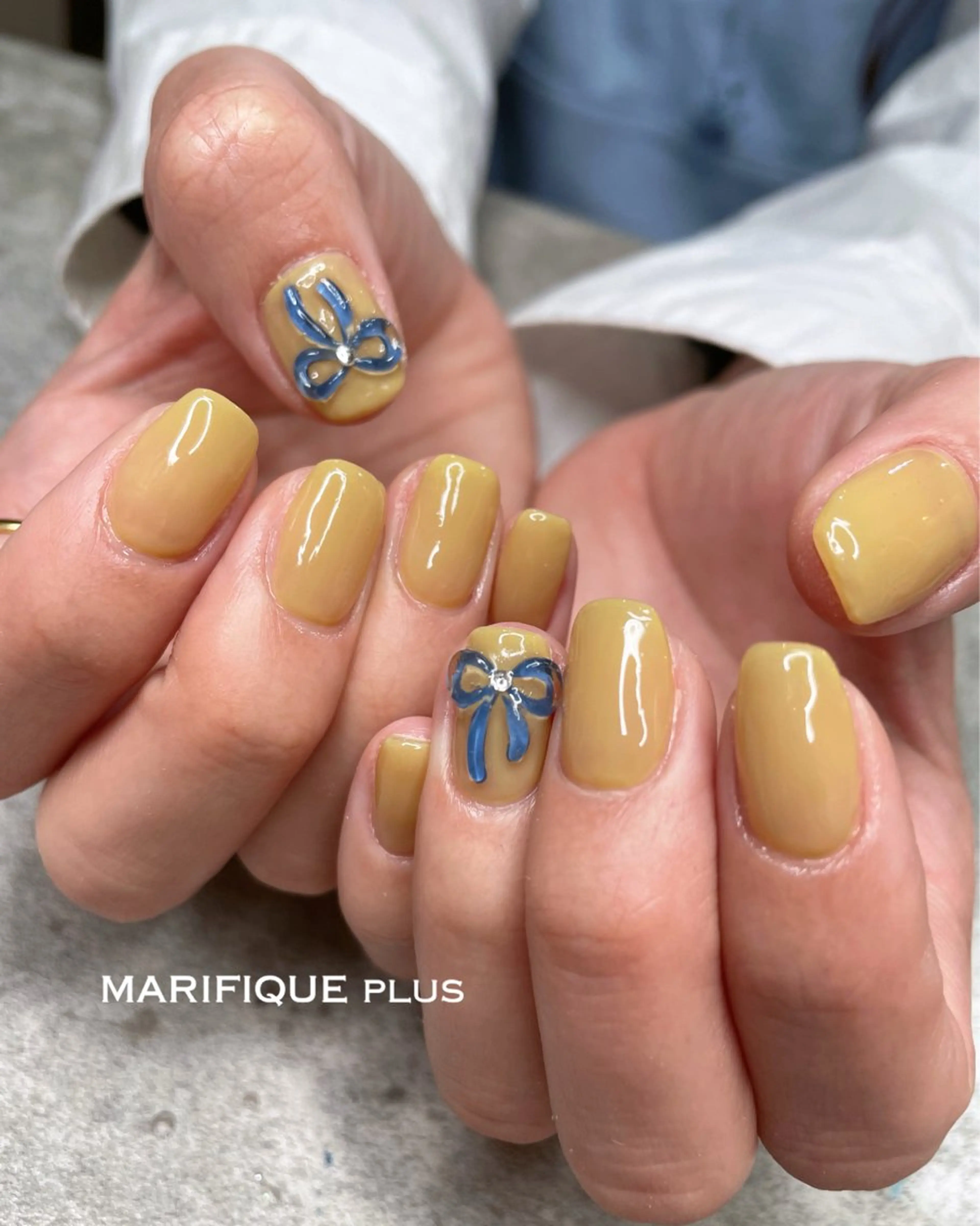 ネイル ワンカラーネイル ぷっくりネイル リボン 春ネイル 黄色 ハンドネイル ma riのネイルデザイン