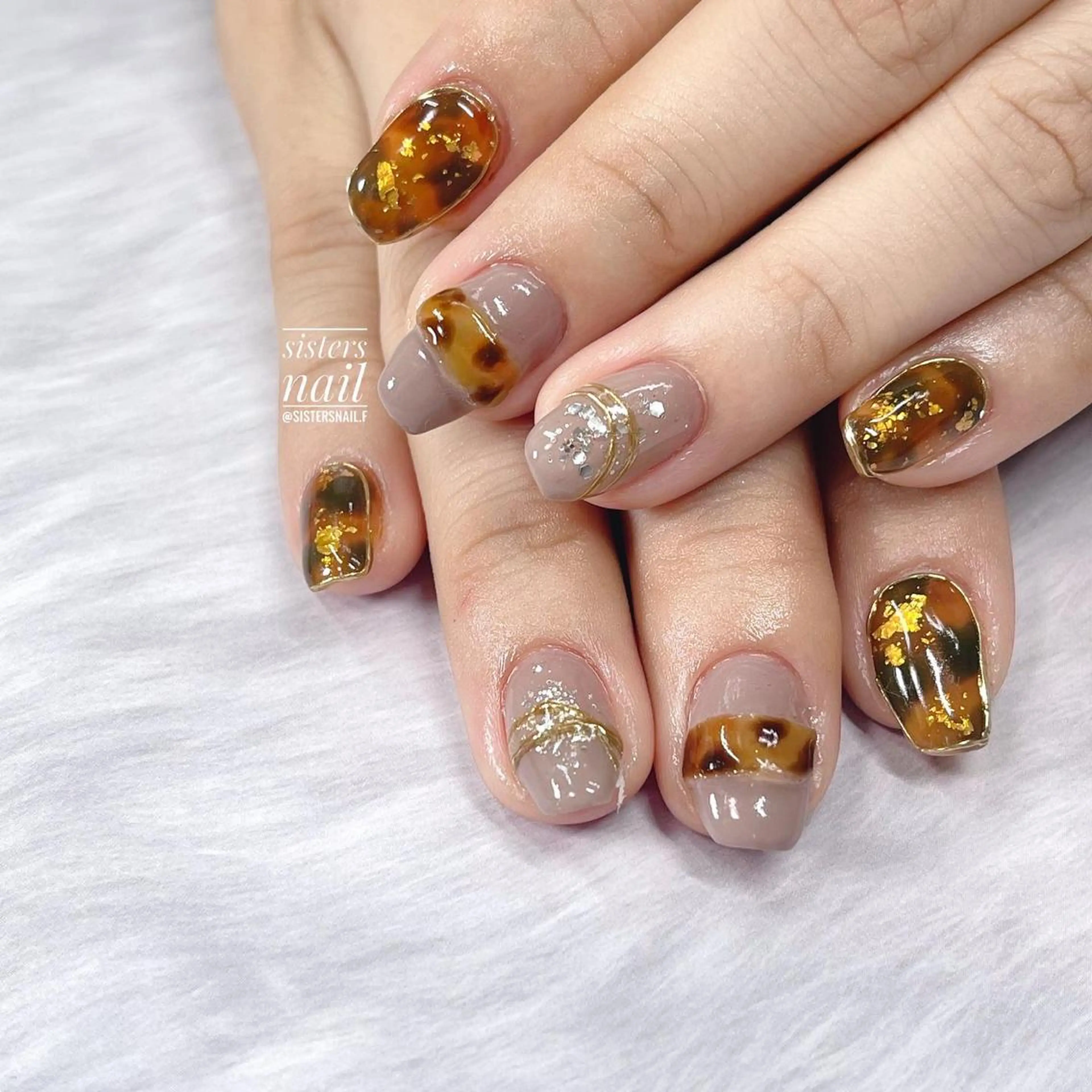 ネイル アートネイル べっ甲ネイル ブラウン キラキラネイル ミラーネイル sisters nail.fのネイルデザイン